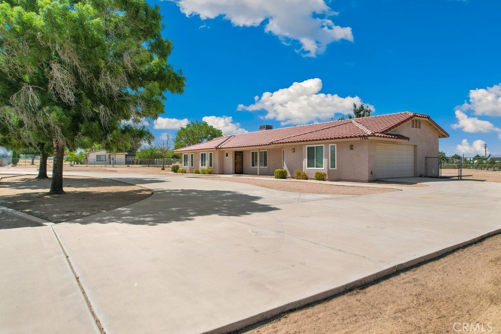 First Time on the Market! Welcome to this uniquely designed, custom-built single-story home — move-in ready and waiting for its next family. Spanning over 2,100 square feet, this spacious residence offers a formal living room and dining area, along with a cozy family room featuring an eye-catching fireplace. The chef’s kitchen comes equipped with clean countertops and all appliances included — perfect for preparing your favorite meals. For added convenience, there’s an indoor laundry room just steps away. Enjoy three generously sized bedrooms, including a private primary suite with direct access to the backyard and its own ensuite bathroom. A second full bathroom serves the remaining bedrooms. Step outside to a beautifully covered patio — ideal for entertaining or relaxing in the shade. The expansive lot is over one acre, offering endless possibilities with RV parking, a custom-built shed, and a horseshoe driveway. Additional highlights include a brand new clay tile roof, new windows, and a two-car garage with a rear access door to the backyard. No HOA! Bring your imagination and make this incredible property your own. Schedule your private tour today — this one won’t last!