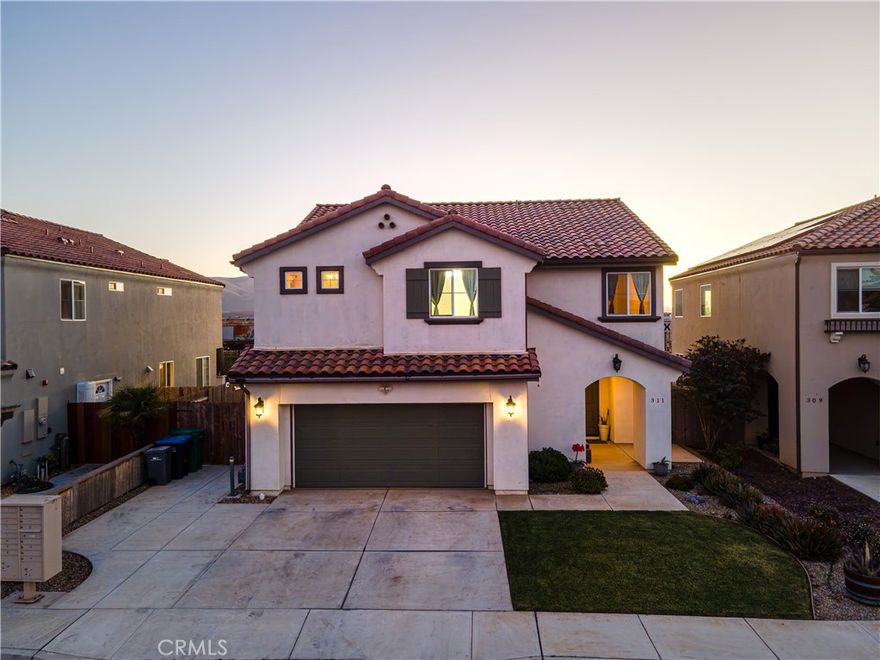 Welcome to 311 Las Flores Drive, a beautifully maintained two-story home nestled in the heart of Guadalupe. With its spacious 4-bedroom, 2.5-bath layout, this residence blends modern comfort with timeless design.Step inside to a bright and airy open-concept floor plan featuring soaring ceilings, abundant natural light, and a seamless flow between the living, dining, and kitchen areas,  perfect for both entertaining and everyday living.The kitchen is a dream for any home chef, boasting rich espresso cabinetry, granite countertops, stainless-steel appliances, and a large  bar seating. The spacious living area offers high ceilings and beautiful windows that frame the backyard, filling the space with warmth and light.Upstairs, you'll find four comfortable bedrooms, including a primary suite with a walk-in closet and private en-suite bath.Step outside to a large backyard oasis featuring a full-length covered patio,  perfect for outdoor dining, relaxing, or weekend gatherings. The low-maintenance landscaping offers space to personalize, garden, or simply enjoy the California sunshine.