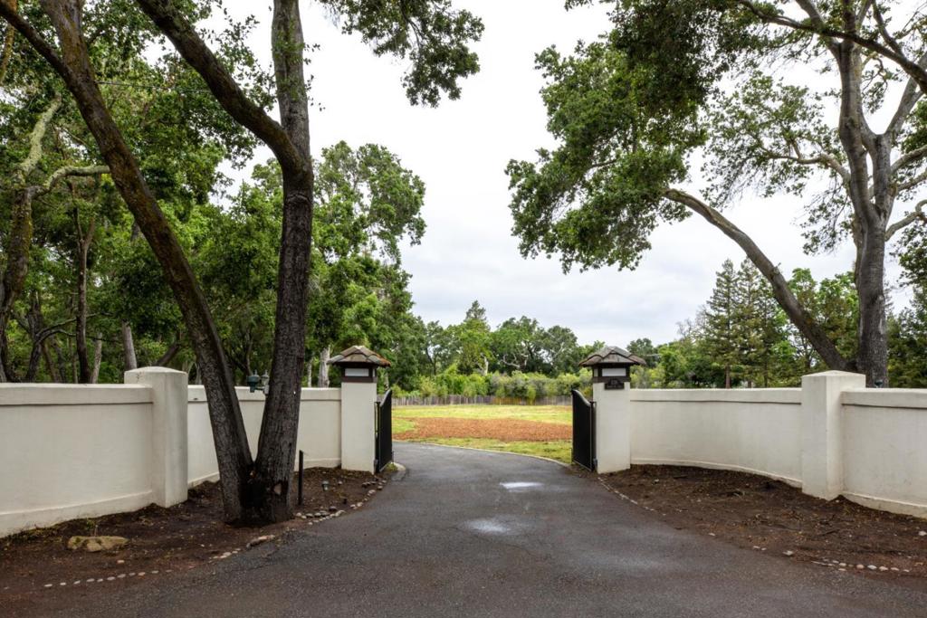 Incredible opportunity to build your dream estate on 2 acres in prime West Atherton. Beautiful mature Redwood and Oak trees line the perimeter of this private, sunlit lot. Completed plans available by Pacific Peninsula Architecture for stunning three-story residence including detached garage, two bedroom guest house, and pool cabana. Landscape design by Studio Green. Close to the Circus Club and Downtown Menlo Park, this rare acreage is the perfect canvas to define the ultimate Silicon Valley lifestyle.