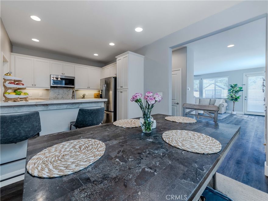 PRICE JUST REDUCED!! STUNNING REMODELED TOWNHOME with PRIVATE BACKYARD in the Heart of the Santa Clarita Valley! Welcome to this beautifully updated townhome offering 1,440 sq ft of bright spacious living in the desirable family-friendly Mariposa neighborhood! Thoughtfully designed with comfort and modern living in mind, this home features an open-concept layout with a stylish kitchen equipped with stainless steel appliances, flowing into a cozy dining area. The family room opens directly to your backyard, with no rear neighbors, making it perfect for your morning coffee, entertaining guests, or enjoying a little gardening retreat. Upstairs, you’ll find two generously sized bedrooms, including a luxurious master suite with a full private dual vanity bathroom and a spacious walk in closet. The second bedroom also offers ample space, great natural light, and its own en-suite full bathroom ideal for guests or family members. Additional highlights include: New water heater, attached one-car garage + assigned additional parking space, private in-unit laundry room and trash is covered by HOA. This community offers resort-style amenities such as a sparkling pool, relaxing spa, stylish clubhouse, playground, dog park, and beautifully maintained landscaping. Conveniently located near shopping, dining, parks, and excellent schools! This turn-key townhome is ready to welcome you home!