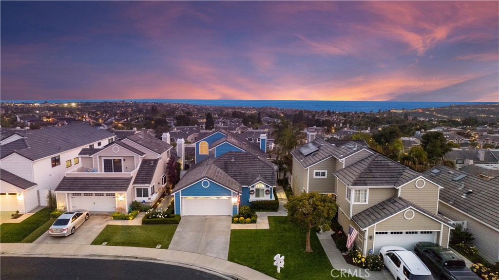 PANORAMIC OCEAN & SUNSET VIEWS from this stunning 3-bedroom, 2-bathroom home in Beacon Hill Highlands. The main floor features a spacious primary bedroom, with an additional secondary downstairs to give the home the feeling of living on one level. Cathedral ceilings throughout the main area make this home feel even more spacious. Upstairs there is a large, enclosed third bedroom with a closet that is very versatile...it could be an upstairs family room, office, or used as a bedroom. It offers a lookout deck, perfect for enjoying the stunning views. The yard boasts a fire pit with built in seating and fountain. The home was repiped in 2019 for added peace of mind. This property offers a truly exceptional coastal living experience. New upgrades include newly painted kitchen cabinets, soft close hinges, new hardware and handles, new stainless steel appliances, and new kitchen faucet. Newly installed carpet, upgraded all interior lighting and ceiling fans, new entry door and closet for upstairs bedroom. New rain gutters, new outdoor lighting and trim, and upgraded viewing deck off upstairs bedroom. Take advantage of the walking trails leading to the beach, and enjoy access to amenities including 3 pools and 6 tennis courts.