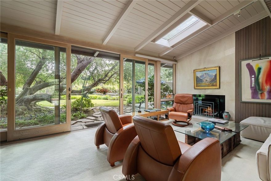 Nestled in lush gardens with mature trees and expansive grassy areas, this architectural masterpiece is a stunning fusion of Japanese design and mid-century modern aesthetics. Situated on a rare half-acre lot, the home is built on a double foundation with extra-thick cement. Inside, every detail reflects meticulous craftsmanship. Solid bleached vertical grain white oak doors feature custom Rosewood knobs, while the chef’s kitchen boasts top-tier Viking appliances, a multi-burner cooktop with grill, and exquisite Paradiso Granite counters with Braun steel soft-close drawers. Solid maple cabinetry adds warmth, complemented by 8” x 8” Spanish tile flooring in the kitchen and hallway. Designed for seamless indoor-outdoor living, the estate offers expansive decks crafted from premium wood, free of knots, creating a tranquil retreat in nature. The Japanese-inspired steam shower features etched Reed pattern glass doors, black walnut-framed cabinets, and teakwood doors, elevating the spa-like experience. Rich in history, this estate was once the heart of Vanderlip Estate gatherings in the 1930s, hosting Hollywood legends like Clark Gable. The grounds include one of the world’s largest olive trees, with a 60-foot spread, famously used in Vanderlip’s Christmas photos. Modern luxuries include German-engineered Grohe fixtures, a tankless water heater with a circulating pump, and an on-site propane tank. This extraordinary estate is a true paradise, where timeless architecture meets natural beauty. The property is located in a surrounding area of Rancho Palos Verdes experiencing active land movement.