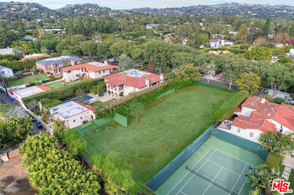On Legendary Roxbury Drive a rare opportunity to build the house of your dreams on one of the most prestigious blocks in Beverly Hills! This vacant lot, just under 24,000 sqft, comes with design plans for a grand scale 25,000sqft Contemporary Estate designed by Gabbay architects. Plans for the home include a sumptuous principal suite with separate his and her bathroom retreats, six additional bedrooms, amenities like a wine cellar, sauna, screening room & massage room. In the basement there is a full kitchen, ballroom with 15ft ceilings, salon, wine room and underground garage for 9 cars. A must-see property on a prime street in the flats with endless history and notoriety. Notable stars have resided on famous Roxbury Drive, Jimmy Stewart, Jack Benny and many more.