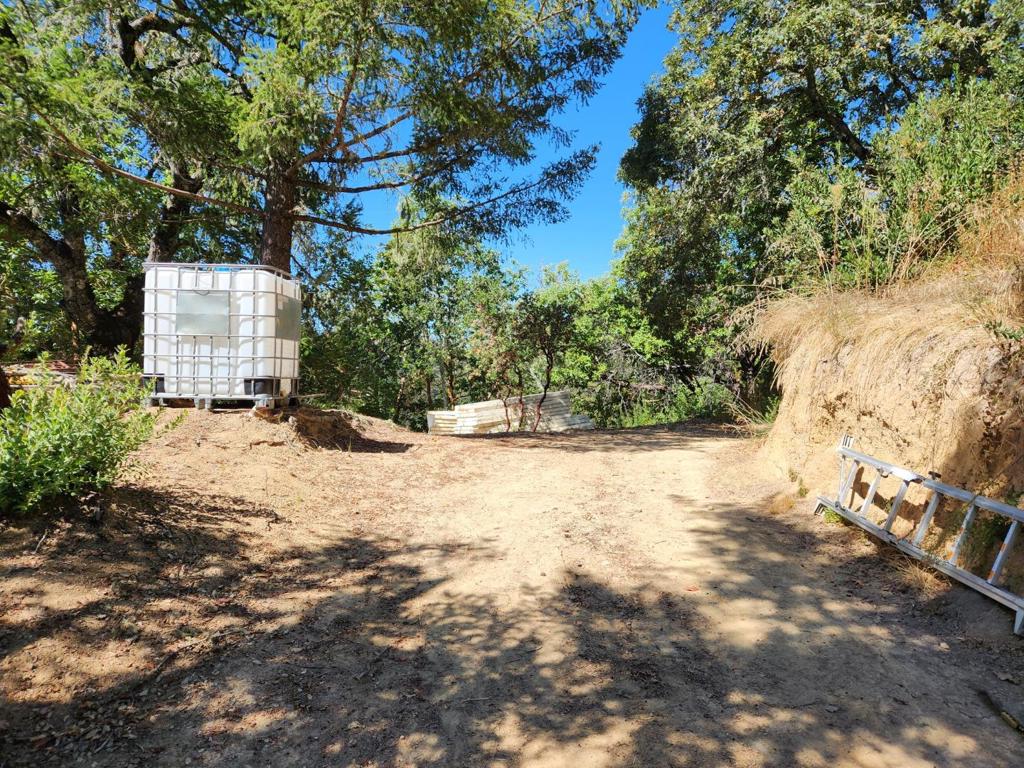 Your own private oasis awaits! Enjoy complete privacy deep in the Santa Cruz acres. This property features 9 acres of fully off grid, sunny land with incredible views. Not for the faint of heart. Bring your spirit of independence and your RV! There are several usable spots including a 40' by 100' meadow.