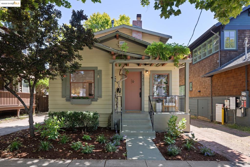 Welcome to 5465 Kales Avenue - possibly the cutest cottage on the block!! Ideally situated in the heart of Rockridge, just a few doors up from College Avenue, this updated 2-bedroom, 2-bathroom home blends original details with modern updates. Originally built as a 1-bedroom, 1-bathroom home with details galore, step inside and feast your eyes on hardwood floors, wainscoting, detailed moldings, and a vintage brick fireplace. The refreshed eat-in kitchen features subway tile and granite countertops with views out the multiple windows to the back deck and expansive backyard. Also featured on the main level are a full bath, bedroom, and living room. Upstairs, you’ll find a leafy retreat: the primary bedroom offers a dramatic pitched ceiling, tranquil tree views, and an ensuite bath with laundry. Seize the opportunity to live on one of the most special tree-lined streets in the neighborhood… imagine yourself relaxing on the sweet front porch, greeting neighbors, and handing out Halloween treats. Don’t forget the many wonderful shops and restaurants on College Avenue. Close to Frog Park, public transportation and freeways. A must-see!