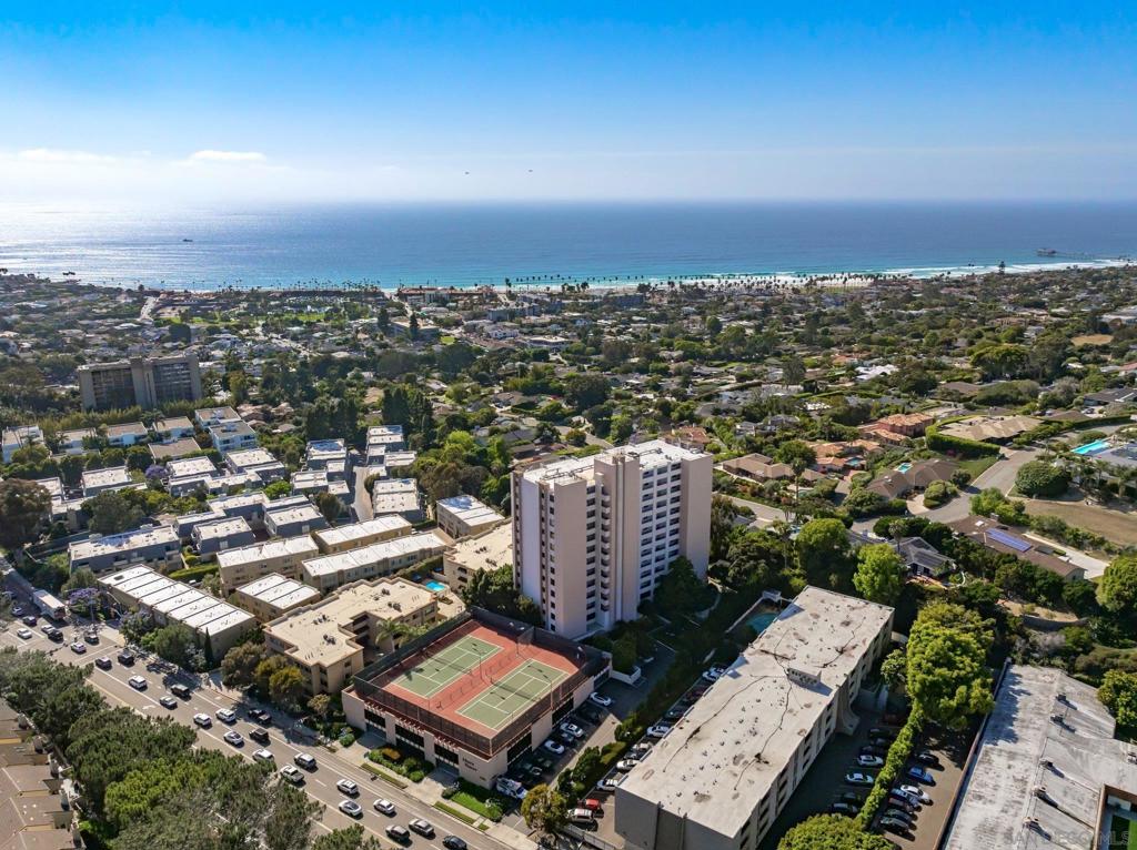Experience elevated panoramic ocean views to the west and captivating vistas of Mt. Soledad to the south. Perched on the 10th floor of the coveted Shore Tower, this desirable corner unit offers stunning whitewater views of La Jolla Shores’ sandy beach from the comfort of your own home. Thoughtfully remodeled with a modern touch, the residence features a sleek waterfall-edge kitchen countertop, updated flooring, and a contemporary bathroom design. Enjoy an exceptional lifestyle with premium amenities, including three dedicated parking spaces, a pool, spa, tennis courts, BBQ area, fitness center, guest parking, and a secure building environment. Ideally located with quick access to the beach, the Village of La Jolla, major freeways, and UCSD, this rare offering is perfect as a primary residence or an elegant coastal retreat. A truly unique opportunity to own one of the few units with expansive, unobstructed ocean views.