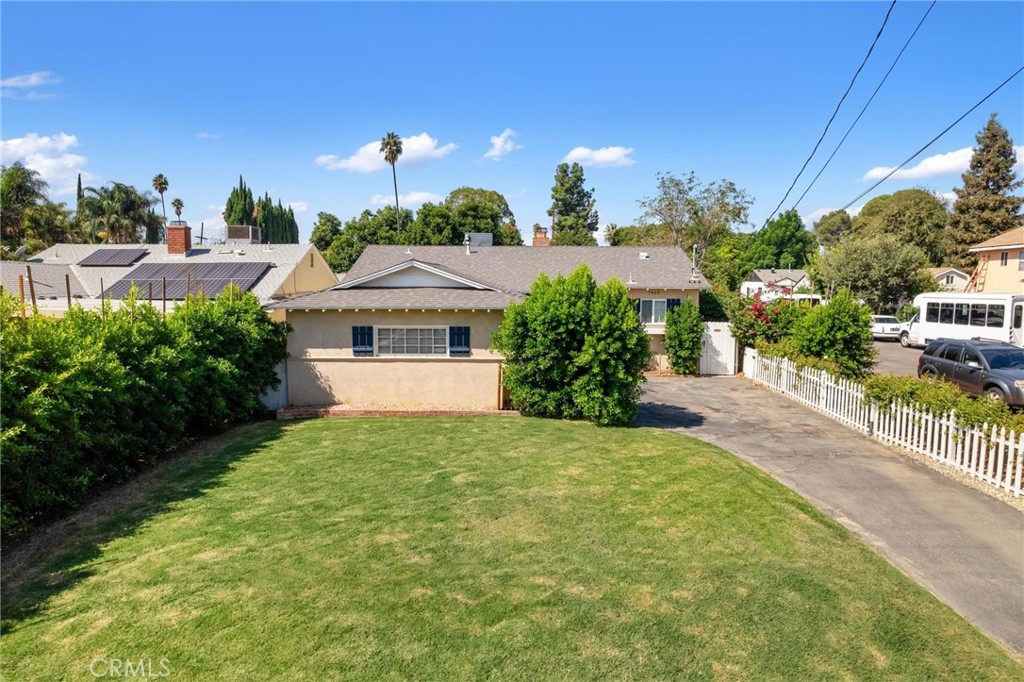 Presenting this charming 4-bedroom, 2-bathroom traditional pool home nestled in the heart of Reseda. With timeless charm and inviting curb appeal, this home feels like it’s been pulled straight from the pages of a fairytale. A picturesque front yard and welcoming porch set the tone, while inside you'll find a warm, character-filled layout with plenty of natural light. The spacious living and dining areas offer the perfect balance of comfort and functionality, leading to a beautifully updated kitchen with modern finishes. Each bedroom is generously sized, including a serene primary suite with its own en-suite bath. Outside to you'll find your own private paradise — a sparkling pool surrounded by lush greenery and a storybook garden, ideal for entertaining or peaceful relaxation. Located on a charming street in a desirable neighborhood, this home blends classic architecture with modern comforts and truly feels like home. Don’t miss your chance to own this enchanting Reseda gem.