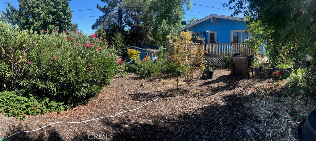 STARTER HOME IN A GREAT SPOT At the end of a quiet cul de sac backing onto open land of over 100 acres is a comfy home on a third of an acre. With full landscaping in the front of the home in front of a full-width deck, you have the sense of a oasis, away from it all. The home has vaulted tongue & groove natural wood ceilings in the spacious living room with granite counter tops in the kitchen, updated stainless steel appliances and three mini-splits for maximum comfort, as well as wood stove for cozy winter nights. There is leased solar to keep your bills low and a detached garage with a large workshop. A great place to start your home ownership journey.