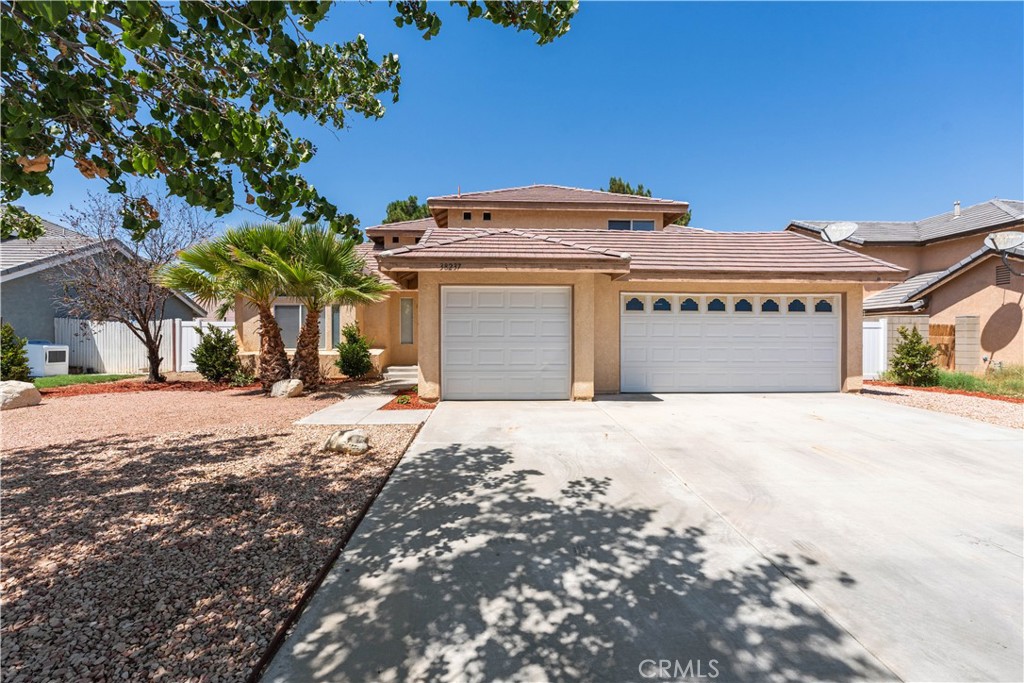 Upgraded and move in ready! This wonderful 4 bed 3 full bath homes boasts beautiful updates throughout. As you enter you first notice the vaulted ceilings from the family room and formal dining that lead into the kitchen and living room complete with a cozy firepace. An oversized downstairs bedroom could double as a downstairs primary bedroom, with a full bathroom and laundry room that connects to the oversized 3 car garage to finish out the downstairs. Upstairs 2 more large bedrooms, a full bathroom, and the primary suite complete with dual closets, double sinks and water closet. Brand new modern finishes, mirrors, and gorgeous light fixtures throughout this home- this one checks all of the boxes!