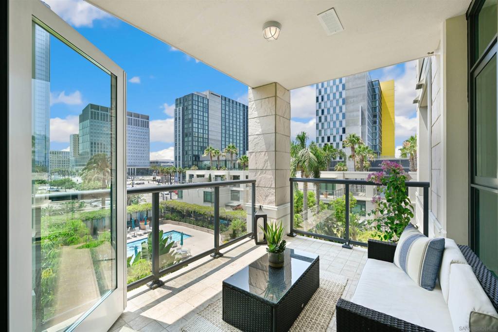 Luxury Living at The Grande South! Experience elevated urban living in one of Downtown San Diego’s most prestigious high-rises—The Grande South. This stunning residence boasts a coveted floorplan with sophisticated upgrades throughout, including rich hardwood floors, a gourmet kitchen, wine bar with fridge, and a built-in office space ideal for working from home. The spacious primary bedroom retreat features a walk-in closet and spa-inspired touches, while the expansive balcony offers a seamless extension of the living space—perfect for soaking in southerly 180-degree views and breathtaking sunsets over the bay. Designed for those who value comfort, style, and convenience, The Grande South offers world-class amenities: pool, spa, sauna/steam rooms, business center, 24-hour concierge, and a guest suite. Don’t miss your chance to live in luxury in the heart of the city.