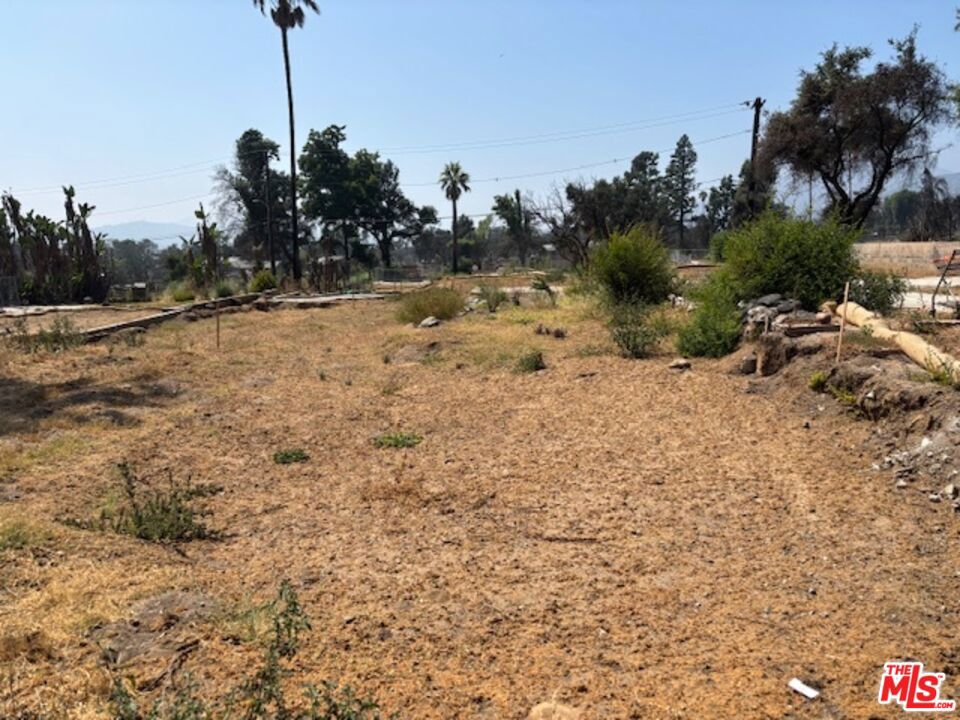 Discover a build-ready 7502 square foot parcel, ready for a fresh vision. Located at 2970 Emerson Way. TRACT NO 7074 on Altadena Map NO 3. This fire-damaged lot in desirable Altadena offers a rare chance to rebuild the community. Unlock the potential of renewal in the foothills of the San Gabriel Mountains! Previously a single-family 1927 , 748 square foot , 2 bedroom, 1 bathroom residence with a detached remodeled garage. Altadena and LA County are offering easy-to-apply and expedited approval for building plans, especially for like-for-like builds (same square footage/similar layout). Whether you're an investor, builder, or homeowner with a dream, this blank slate is primed for development. Both Phase 1 and Phase 2 have been completed, including, environmental clearance with a final certificate of completion (COC) of the property. The site qualifies under California SB9 legislation to potentially support 2 Primary Dwellings & 2 ADU's, offering a tremendous opportunity for rental income, multi-generational living or resale of 2 separate units. The property is owned free and clear, no loan on Title, allowing for a smooth and efficient closing process . Buyers should independently verify all zoning, permitting and rebuilding requirements with Los Angeles County and verify status of utilities with local providers. Buyers are responsible for conducting their own investigations to satisfy themselves regarding future development, ability to add units, required lot size, environmental toxicity, community and neighborhood designation, zoning and taxes. PLEASE REFER TO 3 DOCUMENTS IN THE DOCS FOLDER OF THE MLS especially the FHSZ which clearly states that this property is NOT in a high fire hazardous zone. Drive by only. Please do NOT walk on the Lot.