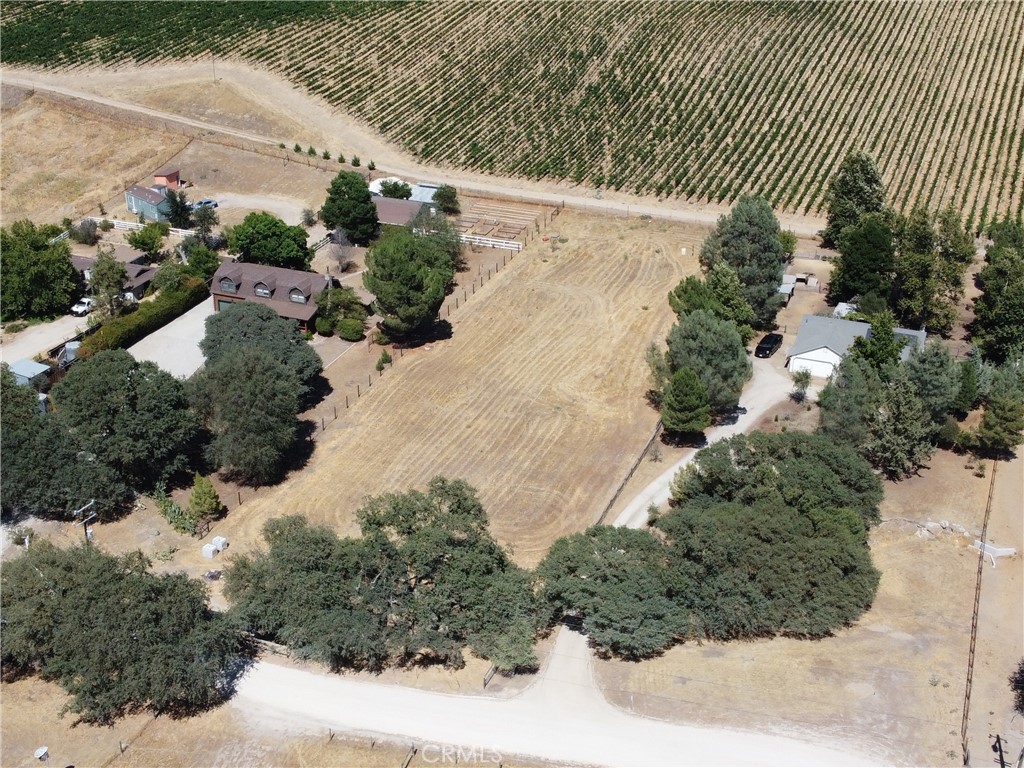 Set amidst the vineyards of Paso Robles's wine country, this extraordinary 1.17-acre parcel offers a rare and luxurious canvas to bring your dream estate to life, where vineyard views stretch endlessly and wine country living reaches its peak. Bordering a picturesque vineyard and surrounded by majestic oak trees, the property offers both sweeping vistas and a sense of complete seclusion, creating the perfect blend of beauty and privacy. Whether you envision an elegant villa, a modern wine country retreat, a timeless farmhouse, or a lucrative investment opportunity, the possibilities are as boundless as the views. With a brand-new well already drilled, a completely flat & level landscape, and power conveniently located on the street, the groundwork is set for you to build something truly spectacular in one of California’s most sought-after destinations. This is more than just land—it’s an invitation to create your legacy among the vines.