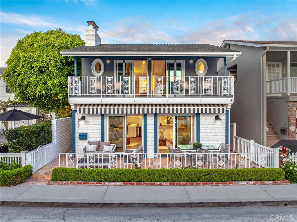 Outstanding opportunity to own a turnkey 4-bedroom, 3-bath home in a prime 100-block location on Balboa Island, just four doors from South Bayfront. The spacious front patio offers Bay views and opens to the first level with an open floor plan, living room with fireplace, dining area, family room, and a bedroom with en-suite bath. The remodeled kitchen features quartz counters, custom cabinetry, a large island, and Wolf and SubZero appliances. Upstairs, the primary suite showcases vaulted ceilings, a fireplace, built-ins, and a covered deck with Bay views. Two additional bedrooms and a bath, a second family room, and a separate laundry room complete the second level. A rare chance to experience the best of Balboa Island living.