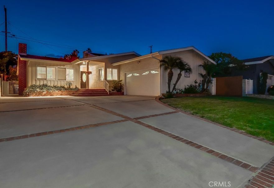 Nestled on a peaceful, flat street in the highly sought-after Miraleste Pines neighborhood, this cherished family home is hitting the market for the first time in 55 years. Lovingly maintained by the same family since 1970, this is more than just a house — it's a place where generations have grown up, celebrated milestones, and built lasting memories. Now it's ready for its next chapter. From the moment you arrive, the home's inviting curb appeal and well-manicured front yard make a lasting impression. A classic covered brick porch sets a warm tone as you step inside to a formal living room anchored by a traditional fireplace and a cozy breakfast nook, perfect for quiet mornings or catching up over coffee. Throughout the home, original oak hardwood floors add warmth and timeless charm. A spacious, sun-drenched family room at the rear of the home features vaulted ceilings, a designated dining area, and direct access to the backyard via sliding glass doors — ideal for seamless indoor-outdoor living. With the holidays just around the corner, there's still time to settle in and host your first gathering in this generous family space. Whether it's holiday dinners, game nights, or weekend celebrations, the family room offers the perfect setting to bring everyone together. The beautifully upgraded kitchen is a cook’s dream, featuring custom cabinetry, granite countertops, stainless steel appliances including a Viking range, and a convenient breakfast bar for casual dining. The main hall offers excellent storage with multiple closets, leading to the primary suite with its own private 3/4 bath. Two additional bedrooms are well-sized and share a full hall bath. Plantation shutters, central heating and air conditioning, and copper plumbing (buyer to verify) provide comfort and peace of mind. The attached two-car garage includes direct access to the interior, along with a designated laundry area. Outside, the private backyard is designed for easy maintenance yet spacious enough for weekend barbecues, entertaining guests, or simply enjoying the Southern California sun. An expansive driveway offers additional off-street parking. This is an opportunity to own a true pride-of-ownership property in a prime location — a home filled with history, love, and endless potential. Move in just in time to make your holiday memories here.