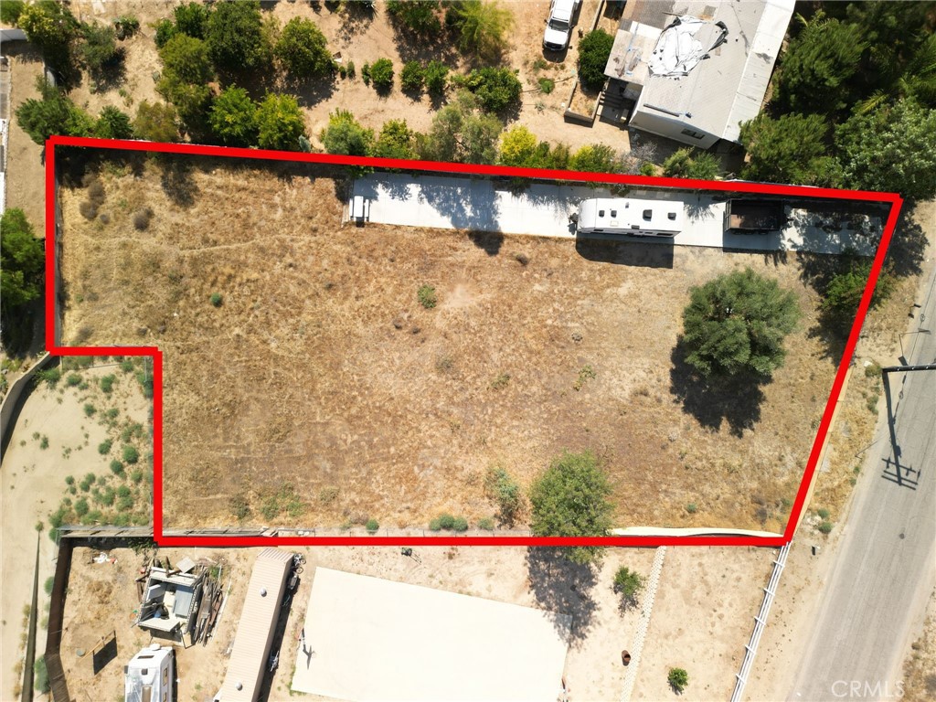 33309 Gafford Road represents a rare opportunity to secure a spacious, prime half-acre flat lot, fully fenced, on a paved road in the heart of Wildomar. Exceptional development potential, utility-ready, in a desirable scenic location, with strong accessibility and favorable zoning, it’s perfectly positioned for new construction. It has a thick concrete driveway poured and Vinyl fencing along one whole side of the property. Whether you envision a custom home, AG-style modular, or manufactured dwelling, don’t miss this chance to capitalize on land availability in this vibrant, rapidly growing Riverside County market. Conveniently located near Interstate 15, this property provides easy access to commuting routes, shopping, dining, hospitals, and regional services. Opportunities like this are rare.