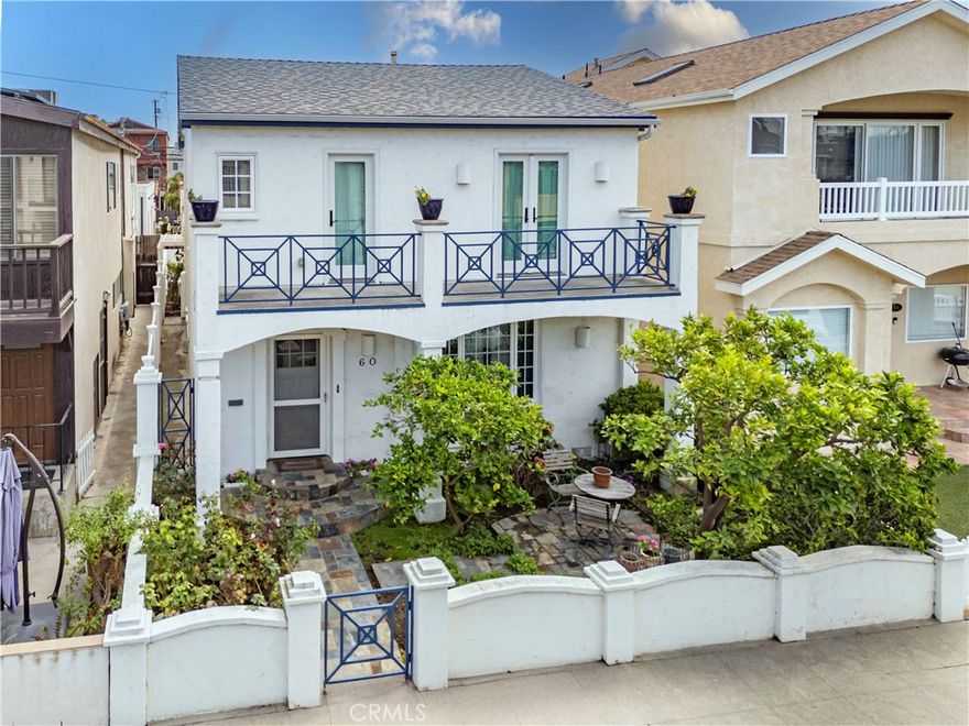 Expansive 3-bedroom, 2.5-bathroom home with 1,844 square feet located in the heart of Belmont Shore. This property features fully paid-off solar panels, a versatile permitted sunroom/office, central heat and air conditioning, and a 2-car garage plus parking for an additional vehicle. A very large living room with hardwood flooring, textured ceilings, and period niches welcomes you and your guests to this coastal retreat. The well-designed floor plan connects the living room to the formal dining area, which flows into an open, light-filled kitchen. The kitchen offers abundant cabinetry and counter space, a casual dining nook, stainless steel appliances, and an island with extra seating. French doors open to a back patio with an outdoor shower providing both hot and cold water. A laundry room with a glass door, a powder bath, and direct garage access complete the first level. Upstairs, the primary suite includes a roomy walk-in closet with mirrored doors, a glass-block shower, private water closet, and a bright permitted sunroom/office featuring a wall of windows, custom shades, and its own air conditioner. Also on the second floor: a charming 1920s bathroom with green and black tile, two additional bedrooms that share a connected balcony with peekaboo ocean views and access to hallway storage. This home blends comfort, character, and an ideal location close to 2nd Street, the bay, the ocean, and award-winning schools.