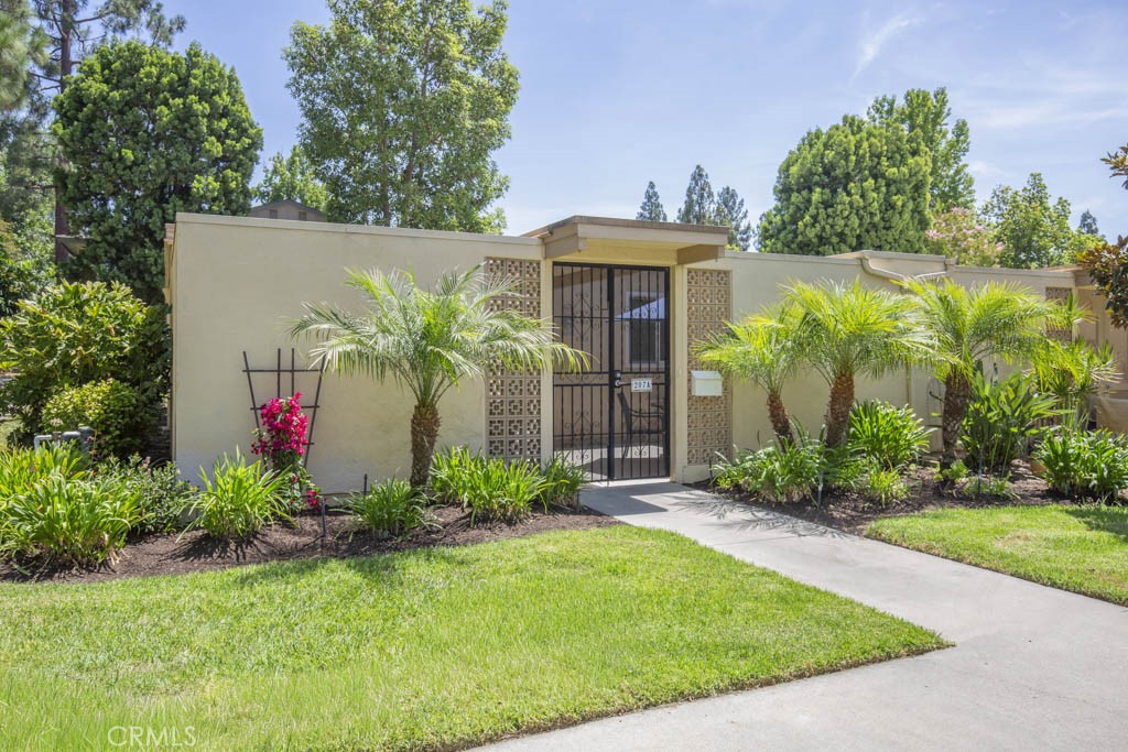 WELCOME HOME to this stunning remodeled “Cordoba” in the highly desirable 55+ Laguna Woods Village! This is a gorgeous single level 2 bedroom, 2 bath end-unit with an open-concept living room and beautifully updated kitchen featuring GE Profile appliances, convection oven, granite countertops, deep stainless steel sink, and custom soft-close cabinetry. This home's original atrium has been enclosed and integrated into the living space, perfect as a formal dining room, den, or home office. Upgraded with all the comforts of home including dual-pane windows, central air, DuChateau premium vinyl flooring throughout, light-diffusing skylights with UV protection, and high-efficiency GE washer/dryer, conveniently tucked away in the patio storage closet. Both bathrooms feature quartz countertops and stone-floor step-in showers. The spacious tiled front patio is perfect for relaxing or entertaining. This beautiful property is in a quiet location next to a peaceful park-like setting. As a resident of Laguna Woods Village, you'll enjoy country club style living with its many amenities including 7 clubhouses, 5 swimming pools, 3 gyms, a championship 27-hole golf course and a 9-hole 3 par executive course. There are over 250 social clubs, craft studios, a performing arts theater, pickleball, tennis courts, equestrian trails, stables, golf cart paths, lawn bowling, bocce ball, pickleball, fare-free bus service, manned security gates, and much more. The Village is conveniently located near beautiful Laguna Beach, shopping, medical services, hospitals, and the 5 freeway.
