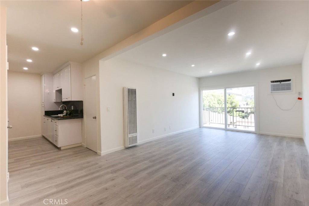 Explore this charming upgraded 1 bedroom, 1 bathroom condo spanning 626 SqFt, now available in Glendale. The inviting front door opens into a bright and airy family room featuring recessed lighting and access to a delightful balcony with neighborhood views. The generously sized kitchen boasts sleek black granite laminate countertops, ample storage, and modern white appliances for a stylish touch. The spacious bedroom is enhanced by mirrored closet doors, and the three quarter bathroom, which includes a walk-in shower, is conveniently located within the bedroom. Enjoy the added benefits of community amenities including a refreshing pool and a convenient laundry area.