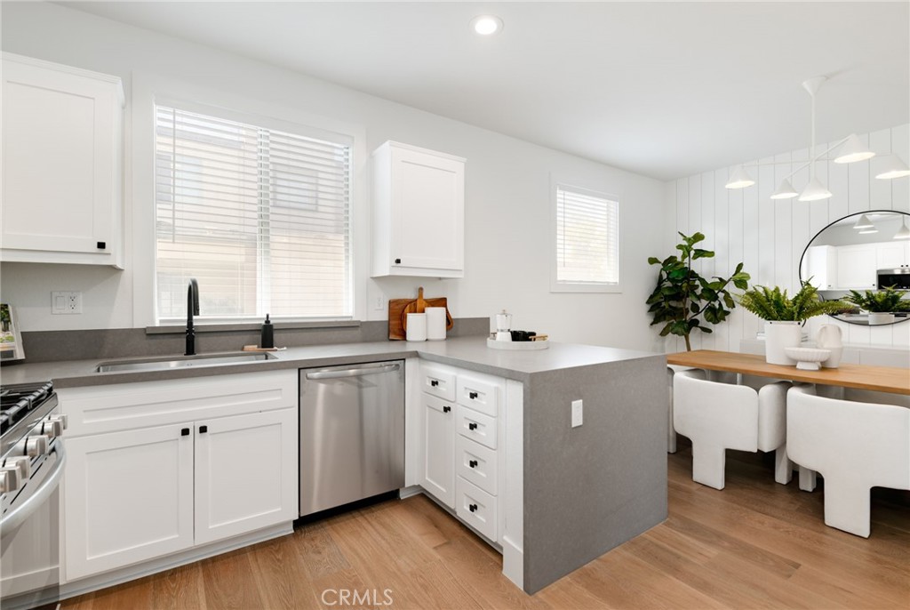 RARE CORNER UNIT townhome in the highly sought after Citracado Village community in Escondido!!! Stunningly remodeled home features include gorgeous White Oak wood floors throughout, White Shaker Cabinets, sleek Leather Finished Quartz countertops throughout all bathrooms and kitchens and recessed lighting throughout. Amazing Waterfall Quartz edge counter highlight the kitchen details including a brand new Frigidaire Stainless Steel appliance package as well as a brand new Maytag Washer/Dryer Set! 3 spacious bedrooms & 3 full baths with an additional powder bath on the second level, a private balcony and private 2-car direct access garage. Enjoy NO MELLO-ROOS tax in this community and Lower property tax rate compared to new builds in the area!! Community features an amazing pool and lounge area. Conveniently located near the freeway, shopping centers, and entertainment venues. Come see it before it’s gone!!