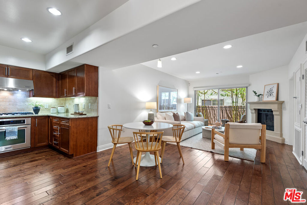 Welcome to resort-style living in the highly sought-after La Playa Court community. This beautifully updated, single-level home offers 2 spacious bedrooms and 2 full bathrooms, all thoughtfully designed for comfort, style, and easy living. Step inside to discover a bright and airy open floorplan, enhanced by recessed lighting, wood floors, and a cozy living room centered around a charming fireplace, and sliding glass doors that lead to your own ultra-private balcony. The chef-inspired kitchen is a true highlight, featuring granite countertops, custom cabinetry, stainless steel appliances, and a window over the sink that fills the space with natural light, and an adjacent dining area. Retreat to the serene primary suite, complete with a custom walk-in closet and a luxurious en-suite bathroom featuring a dual vanity and spa-like finishes. A second generously sized bedroom, in-unit laundry, central HVAC, and two dedicated parking spaces complete the home's thoughtful layout. La Playa Court offers a state-of-the-art gym, spa, and Gigabit fiber internet available (installed in June 2025). The HOA covers earthquake insurance, landscaping, trash, water, maintenance of all common areas, and a master insurance policy, which includes liability and director/officer coverage.
