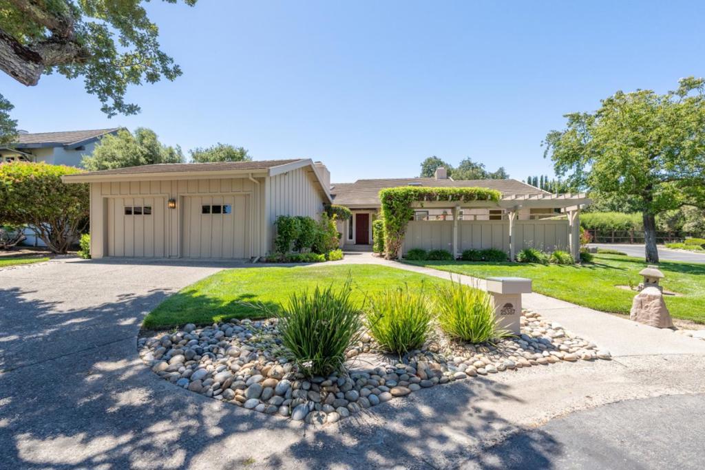 Welcome to your new home in the desirable Markham Ranch community of Corral de Tierra! This spacious single-level home offers 2,618 square feet of well-designed living space with three bedrooms, two full bathrooms, and a half bath. The primary suite is generously sized and thoughtfully laid out for comfort. Enjoy an open, light-filled living room with hardwood floors and a cozy fireplace, perfect for relaxing or entertaining. The home also features a formal dining room with a built-in wet bar, an eat-in kitchen, and access to a private patio for seamless indoor-outdoor living. Situated on a 6,080 square foot corner lot, the property includes a two-car garage and a dedicated laundry area for added convenience. Markham Ranch is a gated community offering a clubhouse, pool, tennis courts, and walking trails centrally located between the Monterey Peninsula and Salinas Valley, in the heart of Steinbeck Countrys famed Pastures of Heaven.