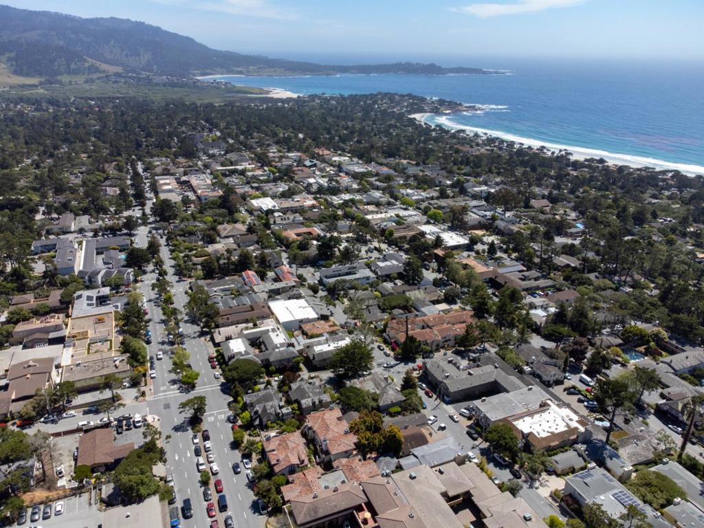 Coastal Elegance in the Heart of Carmel-by-the-Sea Perched above it all in one of Carmels most sought-after buildings, this beautifully appointed top-floor condominium offers sweeping unobstructed south to north views of the Pacific from the dramatic cliffs of Point Lobos to the calm waters of Stillwater Cove and Pebble Beach Golf Course. This private end-unit residence features soaring cathedral ceilings, abundant natural light from multiple skylights, and a thoughtfully designed layout with 3 bedrooms and 2 full bathrooms. The living area flows effortlessly onto a spacious water view deck, the perfect perch for enjoying golden sunsets and the gentle sounds of the ocean. Inside, you'll find warm architectural details, a cozy fireplace, and a refined yet relaxed ambiance ideal for full-time living or a Carmel escape. Located in the prestigious Hillars building, offering elevator access, secure underground parking, and professional management for peace of mind. Just a short stroll to Carmels world-class dining, wine tasting rooms, and boutique shops, this is a rare opportunity to own a turn-key property with exceptional views and an unbeatable location.
