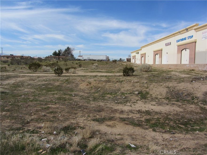 OWNER FINANCING AVAILABLE!  Commercial lot on heavily traveled Hesperia Rd.  This parcel has excellent development potential with close proximity to Bear Valley Rd.  Location is right next to an existing commercial center.  Buyer to verify all zoning and utilities.  Owner may carry - terms negotiable.