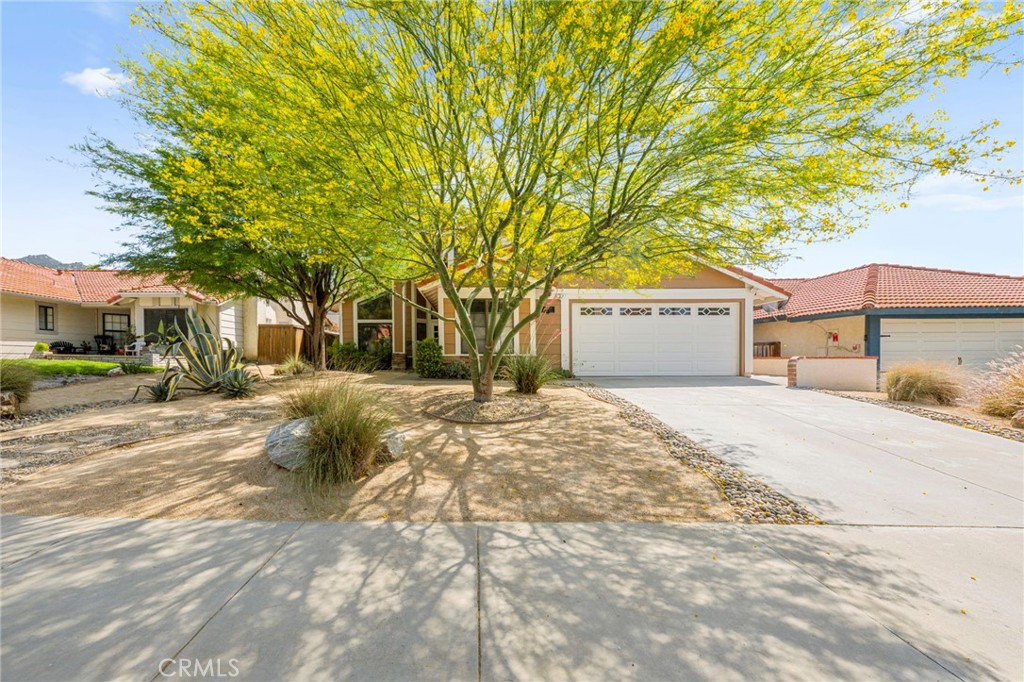 Welcome to this beautifully updated 4-bedroom, 3-bathroom home with 2,113 sq. ft. of living space, nestled in the sought-after Wolf Valley neighborhood of Temecula. Step inside to find soaring vaulted ceilings in the spacious open living and dining areas, complete with a charming brick fireplace and elegant shutters in the dining room. The remodeled kitchen features upgraded cabinetry, stainless steel appliances, and a convenient microwave drawer. The kitchen opens directly to a second cozy living space with another fireplace—perfect for gatherings and entertaining.
The main floor offers a full bedroom and bathroom, ideal for guests or multigenerational living, along with a convenient laundry room. Upstairs, two secondary bedrooms share a Jack and Jill bathroom featuring a dual sink vanity and a shower/tub combo. The spacious primary suite includes its own set of shutters and a private bathroom with a dual sink vanity, soaking tub, separate shower, and a generous closet located right in the bathroom for added convenience. Enjoy the outdoors in your landscaped backyard, which features an Alumawood-covered patio with a ceiling fan, ideal for relaxing or hosting, and a charming gazebo-covered seating area that adds both beauty and function to the space. Additional features include a whole house fan, helping to keep things cool and energy-efficient year-round. This home blends style, comfort, and functionality in a prime South Temecula location. Living in Wolf Valley means you're just minutes from top-rated schools, shopping centers, parks, and the iconic Temecula Wine Country. Whether you're unwinding at home or exploring the vibrant local scene, this property offers the ideal Southern California lifestyle, with comfort, charm, and convenience all in one.