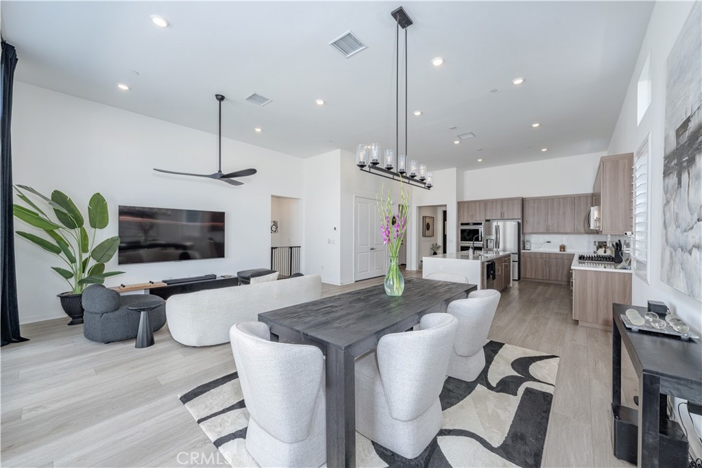 Welcome to this stunning new home, built in 2024, nestled in the prestigious Miralon community. Move-in ready and still under warranty, this model-perfect residence invites you to experience the true essence of Palm Springs living. As you step inside, you’re greeted by soaring ceilings and expansive sliding doors that open seamlessly onto a sparkling saltwater cocktail pool, embodying the ultimate atmosphere of relaxation and joy. The spacious great room is a perfect blend of comfort and luxury, featuring an impressive 85” smart TV, clerestory windows that bathe the space in natural light, elegant plantation shutters, and a stylish ceiling fan. A beautiful dining room chandelier adds a touch of sophistication, while 16 paid solar panels contribute to eco-friendly living. Meticulously designed with soundproof walls, the home is adorned with highly upgraded wide-plank laminate wood flooring that exudes warmth, complemented by elegant terrazzo tile in the entryway and bathrooms. Among the many modern conveniences, you’ll find a Tesla charger in the garage and a high-end refrigerator and washer/dryer, both just six months old. As a resident, you’ll also have privileged access to Miralon's exceptional resort-style amenities. Enjoy refreshing swims in the pools, unwind in the private club equipped with a full-service bar, or hone your culinary skills in the demonstration kitchen. Stay fit and centered in the yoga/fitness studio, play with your pets in the well-maintained dog park, or pick fresh produce from the U-Pick garden. Scenic lake parks, surrounded by over 7,000 producing olive trees, provide a breathtaking backdrop for leisurely strolls. The community offers effortless access to the I-10, conveniently located at the intersection of Indian Canyon Drive and Sunrise Parkway, just off the bustling Highway 111 corridor. Enjoy a quick 10-minute drive to downtown Palm Springs, where a vibrant dining scene and a rich art culture await, along with proximity to some of the finest golf resorts in the area. Experience an extraordinary lifestyle in this remarkable home!