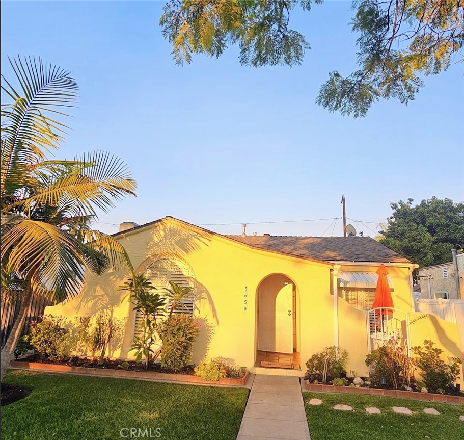 A Timeless Spanish Jewel with Modern Elegance awaiting your personal touch. Nestled on a tranquil, tree-lined street, this home offers the perfect balance of ever-chic architecture and lifestyle.
Enter into the bright and airy living room with Iconic beams, where soaring ceilings and custom plantation shutters create an elegant and welcoming space. Where you’re hosting friends or enjoying a cozy movie night on the big screen, the living room offers you the glamour of a bygone Hollywood.
A classic archway leads into the spacious dining room, bathed in natural light and offering direct access to the front porch. -perfect for your morning coffee or alfresco dining. The updated kitchen features sleek quartz countertops and a clean, modern feel- ready for you to prepare memorable meals for the upcoming holidays and beyond.
The home offers two generously sized bedrooms, each with its own walk-in closet-a rare and highly desirable feature. The remodeled bathroom adds a modern twist with white quartz tub walls, blending classic charm with contemporary style.
detached garage with finished walls — perfect for a home gym, entertainment room, creative studio, or other possibilities to suit your lifestyle. The private backyard features updated fencing, creating an ideal space for outdoor gatherings or peaceful relaxation.
Recent updates include central HVAC system, water heather, privacy fence
Minutes away from Downtown, the waterfront, Queen Mary and Aquarium of the Pacific. Enjoy the energy of the famed Grand Prix. Art lovers will appreciate nearby gems of the Museum of Latin American Art (MOLAA), Long Beach Museum of Art, and the colorful Cambodia Town. Foodies can indulge in the fine Michelin restaurants such as Heritage, The Attic, and Chiang Rai. Long Beach Airport is just a short distance away.