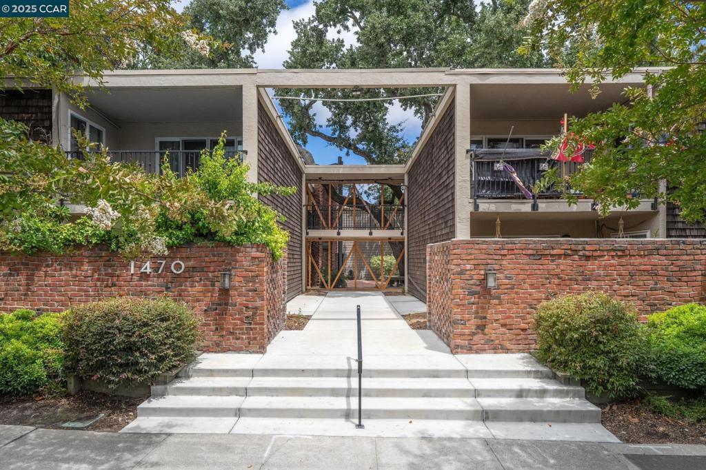 Welcome to a beautifully remodeled townhouse-style condo nestled in one of WC's most convenient and desirable locations—right along the scenic Iron Horse Trail & moments from downtown,BART,Kaiser,Las Lomas High & I-680/24.This sun-drenched 2 Bdr/1.5-bath home spans 1,125 sf and blends timeless design with thoughtful upgrades.The updated kitchen features custom cabinetry,granite countertops & stainless steel appliances, while the expansive living room opens to a private patio complete with an organic garden & extra storage—ideal for entertaining or relaxing in your own quiet retreat.Upstairs, the spacious primary bedroom offers large closets & a private balcony overlooking the lush pool area.A generous second bedroom includes a ceiling fan and custom built-in closets,perfect for guests or a home office.Additional highlights include hardwood floors throughout,custom wrought iron railing,dual pane windows,solid-core doors,in-unit laundry,central HVAC,patio storage shed & assigned carport right outside the front door. Enjoy the amenities of this charming community: swimming pool,gardens,BBQ area—all covered by HOA dues that include hot water,hazard insurance,exterior maintenance,&trash removal.This home is a rare blend of location,comfort & charm—ready for you to move in & enjoy!