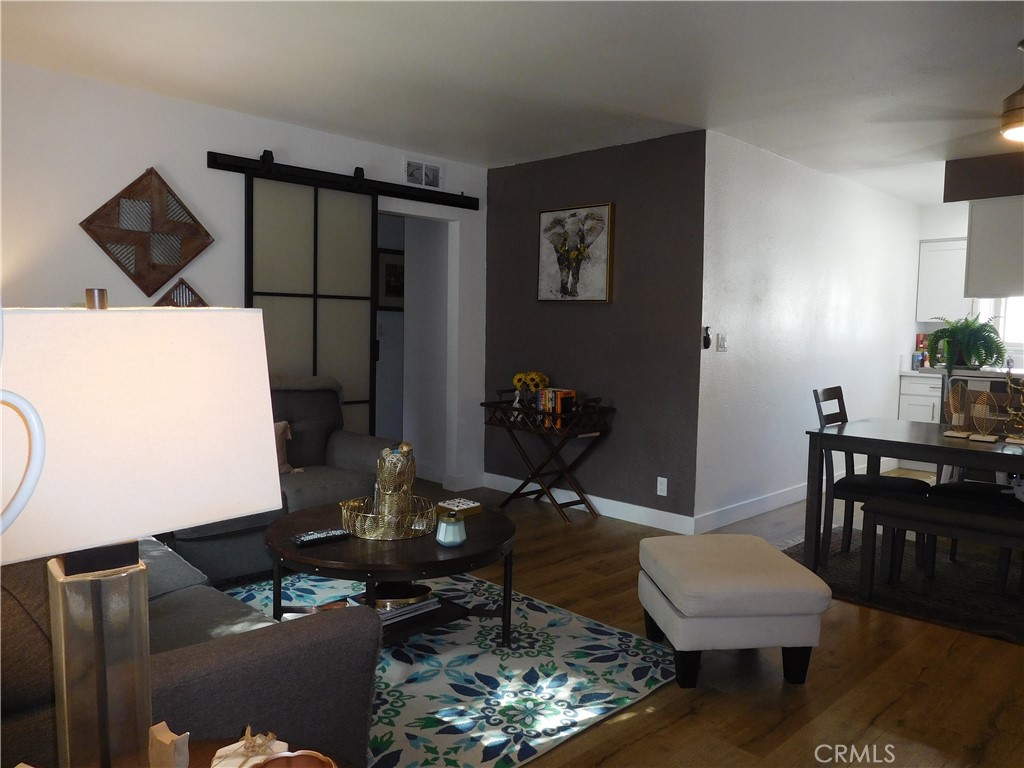 Beautiful light and bright recently renovated 2 bedroom, 1 bath Co-Op condo located in Fountain Park Community with lots of upgrades. When you enter you enter into a large living and dinning area with brand new laminate wood flooring throughout, new custom panting, custom light fixtures all throughout the property. Very spacious modern kitchen is fully equipped with all new stainless steel appliances. From the large living room you go through the beautiful barn doors to both bedrooms and bath room. Bathroom has been beautifully upgraded, and both bedrooms with lots of sunlight and fresh air. This Fountain Park Community has it all, with HOA providing access to a many of amenities including beautiful 2 large pools/relaxation area, sport court and play area and specially HOA DUES COVERS PROPERTY TAXES, FIRE AND EARTHQUAKE INSURANCE, TRASH, WATER, SEWER, EXTERIOR PEST CONTROL SERVICE, PLUS BUILDING AND GROUNDS MAINTENANCE -and which gives you relief and peace of mind, You need to see the property to believe how conveniently it is located close to shopping ,restaurants, entertainment and freeways.