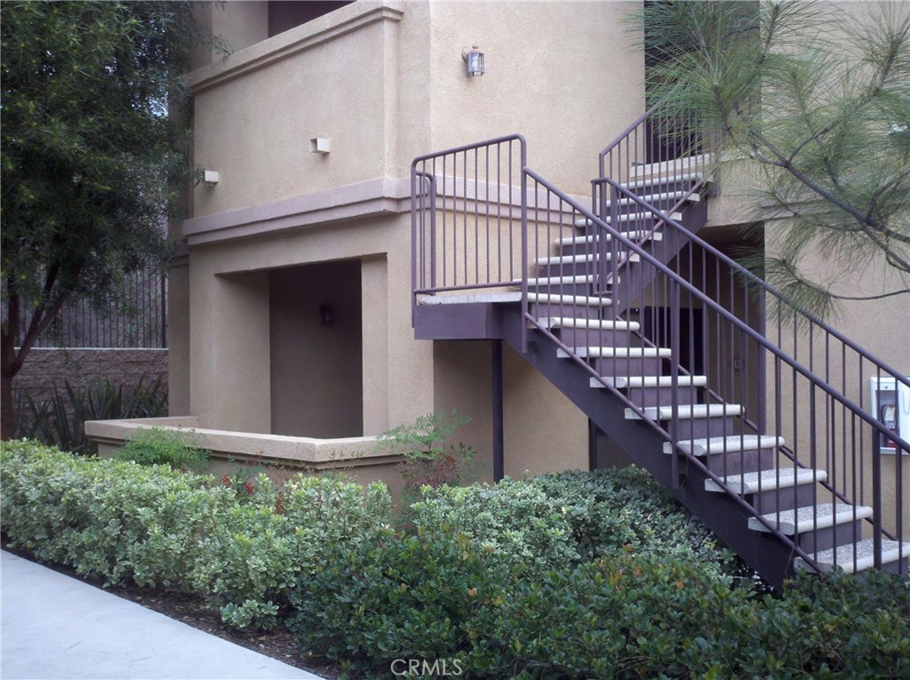 Main Floor Unit, Great property and Great location! Very Spacious Living room area with Fireplace. Bedrooms off the Living room on either side to allow for privacy. Has Vinyl Plank Flooring thoughout Condo. Includes,Washer & Dryer in Laundry room. Has den with closet, that can be a Third Bedroom. Has two patio area. One Patio is fenced. One Garage and One Carport in front of Condo. Gated Community, Racket ball, Clubhouse, Gym, Pool and Spa. Small Playground. Located centrally to award winning Schools,Restaurants,Shopping,Library and 1-15 freeway.