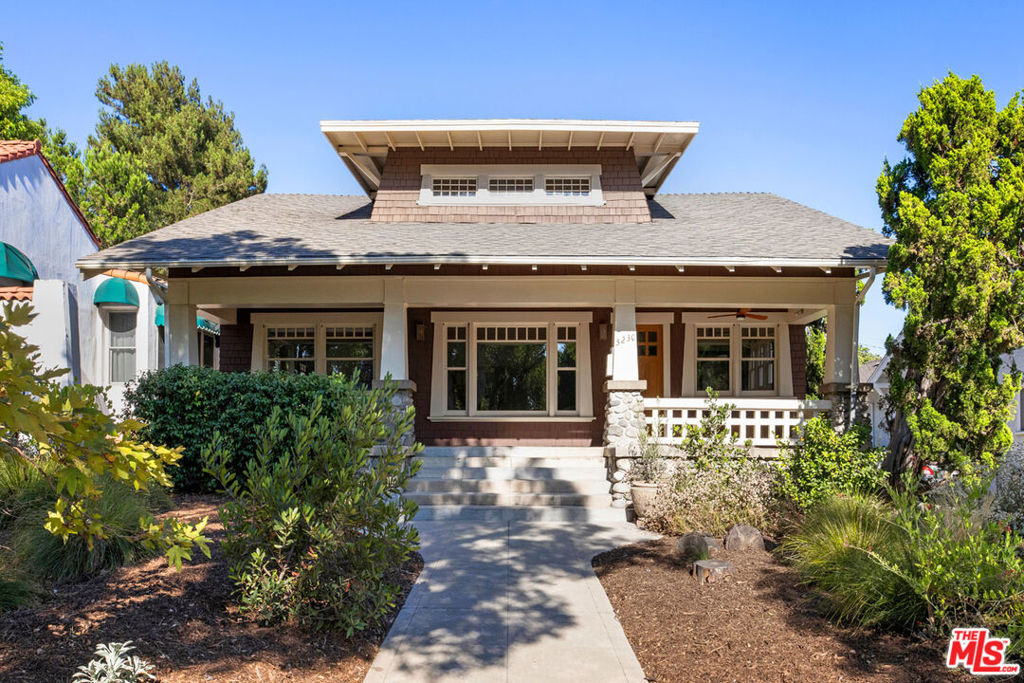 Settle in Eagle Rock with this handsome Craftsman home circa 1910, aglow with Arts and Crafts woodwork and offering an impressive amount of space. Ornate detailing takes center stage in a generous layout featuring formal living and dining rooms with tray ceilings, wood floors, gorgeous built-ins, and a stately hearth. The large kitchen has a center prep island, two sinks, ample storage, and a full suite of modern appliances. Three bedrooms, all ensuite, accommodate all of life's needs, and there's generous flex space for your screening room, play area, gym, or other uses. The patio and grassy yard extend the living space outdoors for alfresco meals and reading in the sun. Amenities include a laundry room, A/C, garage, and storage. On a tree-lined residential street north of Colorado Boulevard, you're close to local favorites Yellow Paper Burger, Trader Joe's, Milkfarm, Casa Bianca, Found Coffee, and more.