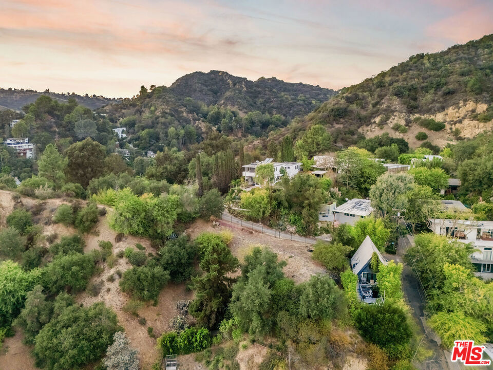 Rare Bel Air Development Opportunity-Three Lots,One Price! This exceptional opportunity includes 3 adjacent vacant lots (4380-027-028,4380-027-027,4380-027-011) in Bel Air! Nestled in the hills and surrounded by multi-million-dollar-estates, these parcels present endless potential for an investor ,developer, or visionary homeowner. With a combined footprint of 13,000 sq ft that provides flexibility and scale, the lots offer the perfect canvas to design and a build a dream estate, or modern architectural masterpiece, offering unmatched and unobstructed Canyon and hillside views. The property has approved plans by the city.Don't miss this great land opportunity , just off Beverly Glen and minutes from Sunset!