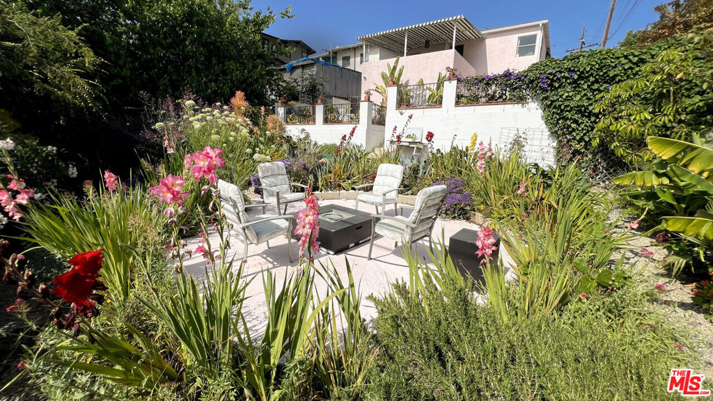 Bright & Versatile 3BR Home with Backyard + Views. AVAILABLE OCTOBER 1st. Tucked into City Terrace Hills, this colorful 3bed/2bath offers sweeping views, quiet surroundings, and easy access to greater LA. Split into 2 levels, the upstairs is perfect for hosting dinner parties indoors or drinks out on the terrace, while the downstairs is accessed through a private entrance, perfect for weekend guests and office/studio space. The large backyard (monthly maintenance included) offers spaces to dine, entertain, and enjoy the gas fire pit. UPSTAIRS:Living Room & Dining Area: Airy and comfortable with room to entertain. Bedroom 1: Views and large open closet space. Bedroom 2: Larger and terrace access. Terrace: Large covered patio with views, string lights and outdoor furniture included. Bathroom 1: Full shower & tub. Kitchen: Ample counter space and storage. DOWNSTAIRS: Bedroom 3: Perfect for guests, includes HVAC Mini-Split. Bathroom 2: Ensuite. Just remodeled. Includes walk-in shower. Work Space: 'Flex space' that can be used as an office, library, or studio. Laundry Room: Washer & Dryer included, plus plenty of additional storage. BACKYARD:Private backyard featuring upper level deck with outdoor dining table and chairs. Sunken Garden includes lush plants, irrigation system (no need to water), and gas fire pit with chairs. Additional Details:1 Year Minimum Lease. Required Unfurnished. Pets Allowed. Backyard Included, with outdoor dining and fire pit. Monthly Landscaping Included. No Garage Access. Washer/Dryer In-Unit. Central AC & Heating. Driveway Parking: Small driveway available, or spaces in front of house and on street. No permits required, easy for guests.