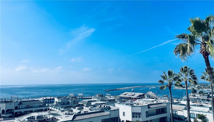 Enjoy oceanfront living with views of sailboats and sunsets over the Pacific ocean. Views are from every room as well as the spacious deck.   Recently remodeled and upgraded with new carpet, paint, windows and window treatments. The kitchen has granite counters, newer cabinets, stainless steel appliances and laminate wood flooring.  The living room has plush new carpet and a cozy wood burning fireplace. Each bedroom has a walk-in closet and fabulous ocean views. This resort style complex features  two pools, a state of the art fitness center, lush landscaping with streams and waterfalls throughout.  Enjoy beach activities, such as volleyball, boating, fishing and surfing as well as a 40 mile bike path.  There are numerous restaurants with both fine dining and casual outdoor dining.  Summer concerts, farmer's markets, marina and public library all just a few steps away.  Laundry is located in each building and there is assigned parking for two cars in space 83, level P-1.  Additionally there are numerous EV charging stations in the gated guest parking area.  The owner wants an initial six month lease term due to temporary price restrictions, however, will consider a longer term lease at current market value after the initial term.