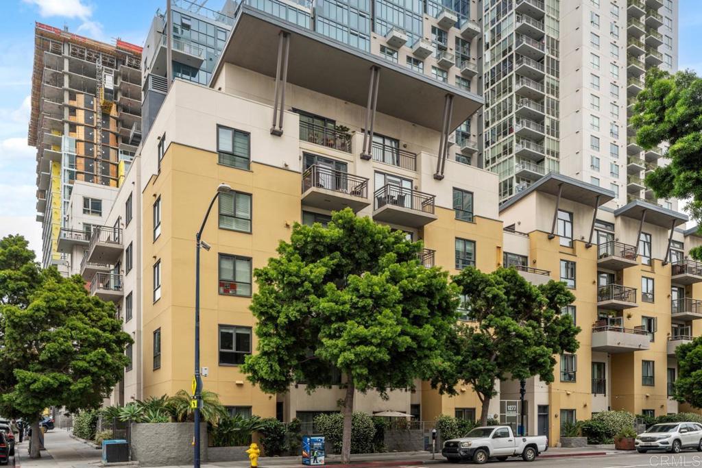 Experience urban sophistication in this spacious, partially furnished 2-bedroom, 2.5-bathroom condo at Treo, located at 1277 Kettner Blvd, Unit 300 in the heart of downtown San Diego. With 1,265 square feet of living space, this rare two-story layout offers excellent separation between living and sleeping areas—an uncommon feature in downtown residences. The modern kitchen is outfitted with stainless steel appliances, and the unit includes in-unit laundry, central heating and air conditioning, and city views for year-round comfort and style. A convenient half bath is located on the lower level, ideal for guests. This home offers dual street access, with two staircases located just outside the front door—providing quick entry to A Street and easy access to the Kettner lobby and Kettner Boulevard. It’s also situated on the beautifully landscaped garden-level courtyard, offering immediate access to the pool, fitness center, and other amenities. The combination of street-level convenience and resort-style features is truly unique in downtown living. One assigned garage parking space is also included, adding to the convenience of this urban retreat. Residents of Treo enjoy access to a range of upscale amenities, including a heated lap pool, spa, fitness center, BBQ areas, and a clubhouse. This home combines contemporary comfort with vibrant city living, making it a standout choice for those seeking convenience, style, and downtown energy.