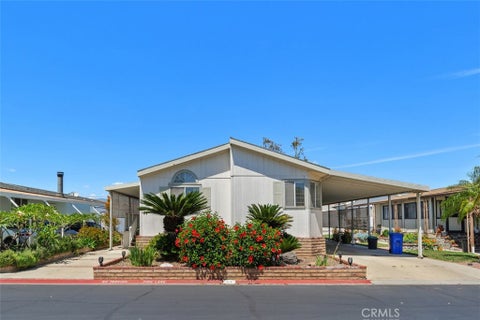 Photo of 1456 E Philadelphia St Spc 77 St, Ontario, CA 91761 (MLS # IV26089982)