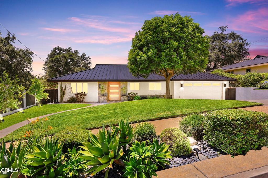 Welcome to this impeccably reimagined contemporary estate in Pasadena's sought-after Hastings Ranch neighborhood. Taken down to the studs and expanded in 2020, this home lives like new construction--thoughtfully rebuilt with high-end finishes, modern systems, and a design that blends elegance with everyday comfort. Over a million dollars has been spent on remodeling the property and it shows. Every detail has been carefully curated for style, comfort, and function.A striking exterior welcomes you with fresh concrete walkways, slate planters, and lush landscaping. Step through an oversized walnut pivot door into a stunning open-concept interior where 16-foot ceilings and walls of glass create a bright, expansive atmosphere. A dramatic double-sided slate fireplace anchors the living space, adding warmth and sophistication.The chef's kitchen is a true centerpiece, outfitted with Thermador appliances, sleek European cabinetry, hidden outlets, and a massive quartz island with seating--perfect for entertaining. The adjacent dining area is wrapped in glass, offering seamless indoor-outdoor flow and breathtaking treetop views of Pasadena.The primary suite is a private retreat featuring floor-to-ceiling windows, a custom Elfa walk-in closet, and a spa-like bathroom with a dual rainfall shower, sculptural concrete bench, and quartz counters. All three bathrooms throughout the home are luxuriously appointed with premium cabinetry, under-cabinet lighting, and Uspa electronic bidets.Step outside to a resort-style backyard--your own private oasis. The 20' x 40' heated pool includes three jet decks, Baja shelf with bubblers, and a 10-person spa. Entertain with ease at the slate outdoor kitchen featuring a Napoleon BBQ, sink, beverage fridge, and concrete counters. Lounge on the Trex deck, gather around the custom fire pit, or enjoy the low-maintenance artificial turf year-round.Modern upgrades include new plumbing, electrical, sewer line, HVAC, water heater, dual-pane windows, and a stylish, long-lasting steel roof--delivering peace of mind and lasting value.This is more than a home--it's a lifestyle. Don't miss the opportunity to own a true showpiece in one of Pasadena's most coveted neighborhoods.