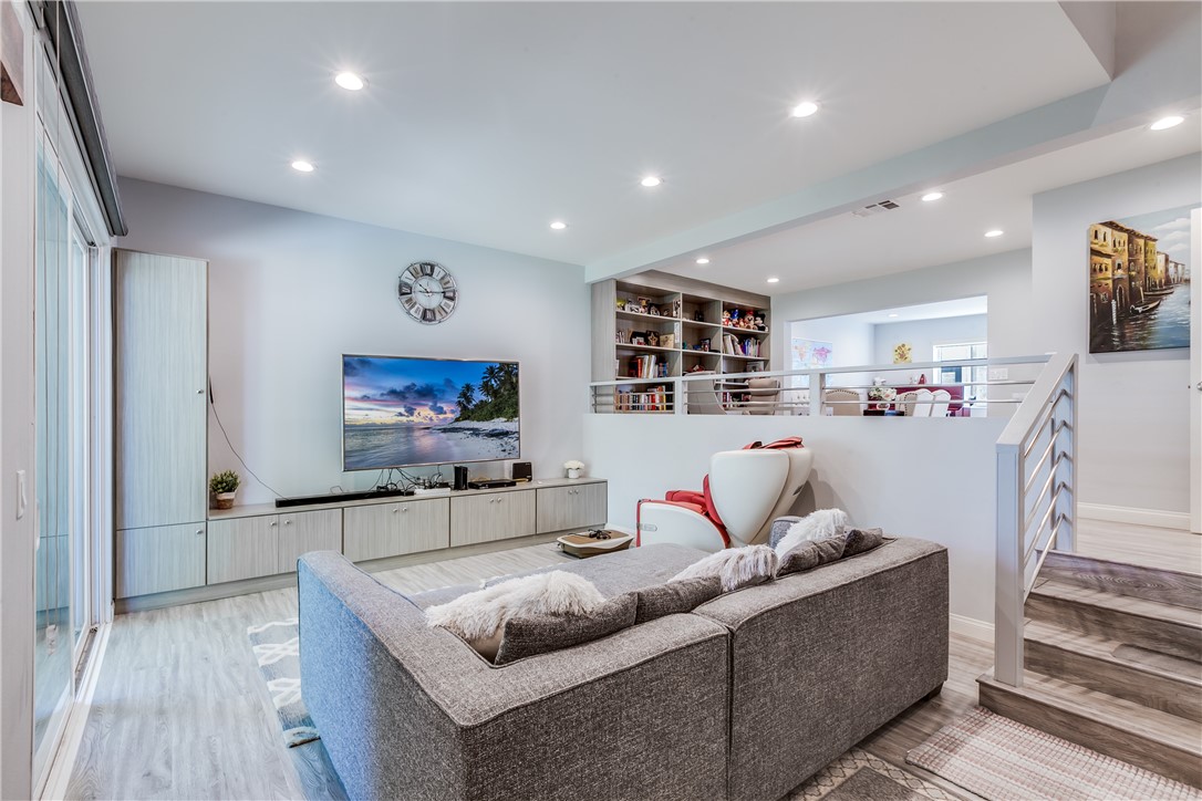 This elegant tri-level townhome has 2 bedrooms AND 1 BONUS ROOM located in the desirable neighborhood of Arcadia and award winning Arcadia school district. $100k+ spent on all custom quality upgrade for the whole house in 2017. This north Facing property has a double door entry and hardwood floor throughout. There is a large sunken living room with the view of the mountains. Small guest bathroom and bar on the main floor. 2 bedroom suites on the 2nd floor, The high-ceilinged spacious master bedroom have a private balcony to better enjoy the view of the mountains. The laundry room is located conveniently on the 2nd floor between the suites. Both of bathrooms have been totally remodeled with high ends quartz counter tops, tile floors, custom cabinets and new plumbing. Well maintained property. Plus about 200 SQ. FT bonus room is not included in the assessor's square footage could be your 3rd bedroom or office. Arcadia Mall just in front of you, close to Supermarkets, restaurants, banks, bus stop and walking distance to Arcadia High School, Methodist Hospital the top 100 in the US. This HOA community offers a clubhouse, pool, spa, and sauna for your health and entertainment. Come by to see this beautiful home, you will love it!!! This is definitely a must see!!!