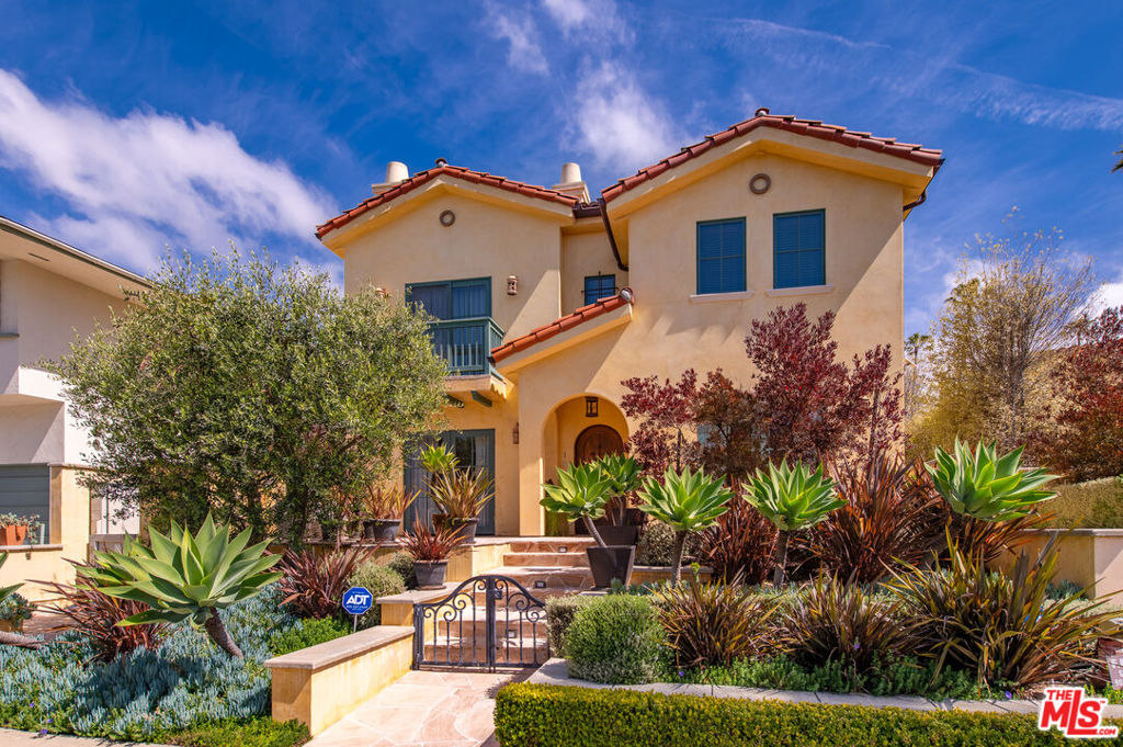 Luxurious Spanish villa townhome nestled in an exclusive 4-unit building, less than one block from Montana Ave. Built is 2010,this unit boasts exquisite wood finishes and high-quality maple floors, creating an inviting ambiance that defines sophisticated living. The open layout flows seamlessly into the dining area, spacious kitchen adorned with luxury appliances, perfect for culinary enthusiasts and entertainers alike. Ascend to the second level where you'll find two bedrooms, each with walk-in closets and designated bathrooms. Escape to your own oasis with four private patio spaces, including a rooftop deck offering stunning views of the Santa Monica mountains. The 3-car garage features an electric car charger and ample storage for your vehicles and belongings. Situated in the Wilshire-Montana neighborhood.