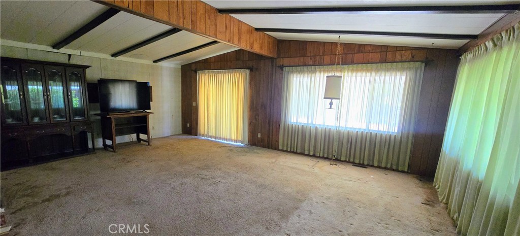 Incredible opportunity, so don't miss this one! Just off Hwy 175, only blocks from the center of Middletown rests a 1,920 Sq.Ft. double-Wide 2bd/2ba manufactured home, offering tremendous potential for the right buyer. This home rests on a .95 acre parcel accompanied by another creek parcel of .63 parcel totaling 1.58 acres along "Dry Creek" seasonal water way. Property boasts of flat workable land, zoned for agriculture and husbandry, and supported by strong producing Water Well. New roof installed in 2021 on both the main home and detached double bay garage, that includes a workspace office and dry cold storage room. This property is located in an ideal area of south Lake County, making an easy commute to Napa or Sonoma Counties. With the combination of privacy, acreage, and versatility, this property is perfect for Buyers seeking to build their future or a long-term investment opportunity. This property will not last long on the market at this price.