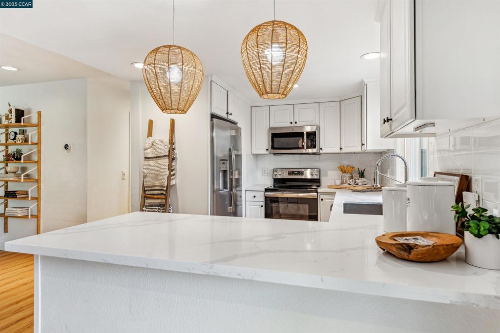 Welcome to this beautifully updated, single story, end unit nestled in one of San Ramon's most desirable neighborhoods, Twin Creeks West! Close proximity to highly rated Twin Creeks Elementary, this spacious 2 bedroom, 1.5 bath home offers a rare blend of modern upgrades and unbeatable location. Step inside to an open-concept floor plan that boasts abundant natural light and seamless flow – perfect for both everyday living and entertaining. The home features extensive updates throughout, including stylish LVP flooring, recessed lighting, designer fixtures, and a beautifully remodeled kitchen with quartz countertops and stainless steel appliances. Both bathrooms have been tastefully upgraded with modern vanities and lighting. Enjoy peaceful outdoor living with a private patio, and the added privacy and quiet of an end unit. Community amenities include lush greenbelts, walking trails, and nearby parks, a community pool and club house. Home includes a detached parking garage right behind the unit and an additional uncovered spot right next to the garage. Tons of additional parking for guests as well.