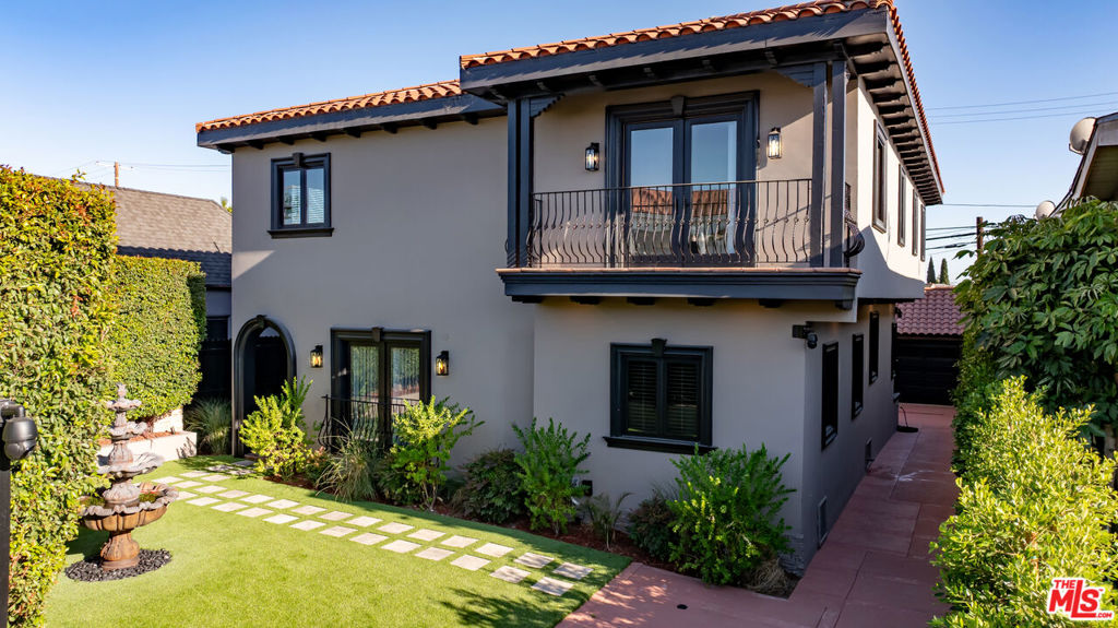 Experience the perfect blend of timeless elegance and modern luxury in this privately gated Mediterranean estate, ideally located in the heart of Miracle Mile. Just moments from world-class cultural destinations such as LACMA, the Academy Museum, Petersen Automotive Museum, and the La Brea Tar Pits and only minutes from Beverly Hills and The Grove this residence offers the ultimate in convenience and sophistication. This expansive home features 9 spacious bedrooms and 9 beautifully appointed bathrooms, each showcasing premium finishes and custom cabinetry. Designed for both comfort and lifestyle, the residence includes a state-of-the-art private theater, a dedicated gym area, an executive office, and dual-level laundry rooms for added convenience. Dual-zone heating and air conditioning provide optimal climate control year-round. Enter outside to your own private oasis, where lush landscaping creates the perfect backdrop for relaxing or entertaining guests. A two-car garage completes this thoughtfully designed estate, combining elegance with everyday functionality. This home is a true sanctuary in one of Los Angeles' most coveted neighborhoods, offering the ideal balance of classic charm and modern sophistication.