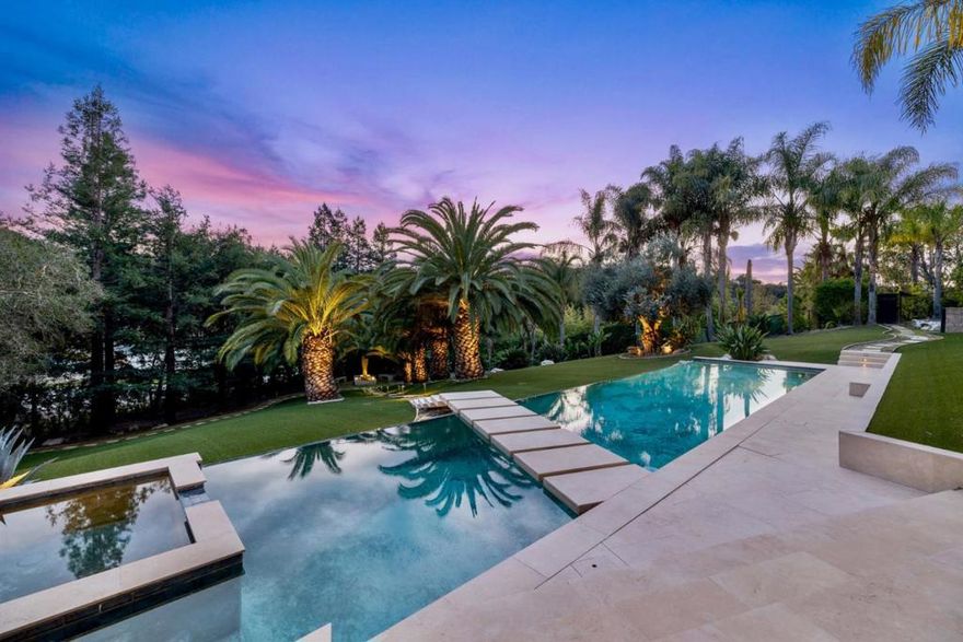 Los Altos Hills with Palo Alto Schools! The pinnacle of luxury in Silicon Valley, built in 2013, features eight bedrooms and 11 bathroomsincluding a guest house/ADU with a full kitchen, living room, and separate entrance built in 2022. It offers a formal dining room, a grand living room, limestone terraces, balconies, lush landscaping with over 20 palm trees, waterfalls, a home theater with 16 leather recliners, a wine cellar, an elevator, a fully equipped #gym, and five-car garages with #EV charging stations. Outdoor Amenities include #Infinity #Pool, #BBQ #SportCourt #Terraces & #Balconies #Limestone finishes #Sola System. Perfect for #TechExecutives and #GlobalBuyers, the outdoor spaces are designed for unforgettable moments, whether hosting summer parties or unwinding on a peaceful evening under the stars. Quick access to #Meta, #Google, #Apple #venturecapitalfirms #SFO #SJC #SiliconValleyLuxury#LuxuryRealEstateCA#Stanford#ModernMansion #HighEndLiving #SiliconValleyEstate#AthertonHomes#LosAltosHillsRealEstate #WoodsideLuxury #PrivateResortLiving#TechHubHomes#Stanforduniversity#LuxuryHomesCalifornia #BayAreaRealEstate #SmartHomeLiving#EVReadyHomes#InfinityPoolEstate#Atherton, #LosAltosHills, #Woodside #PaloAlto