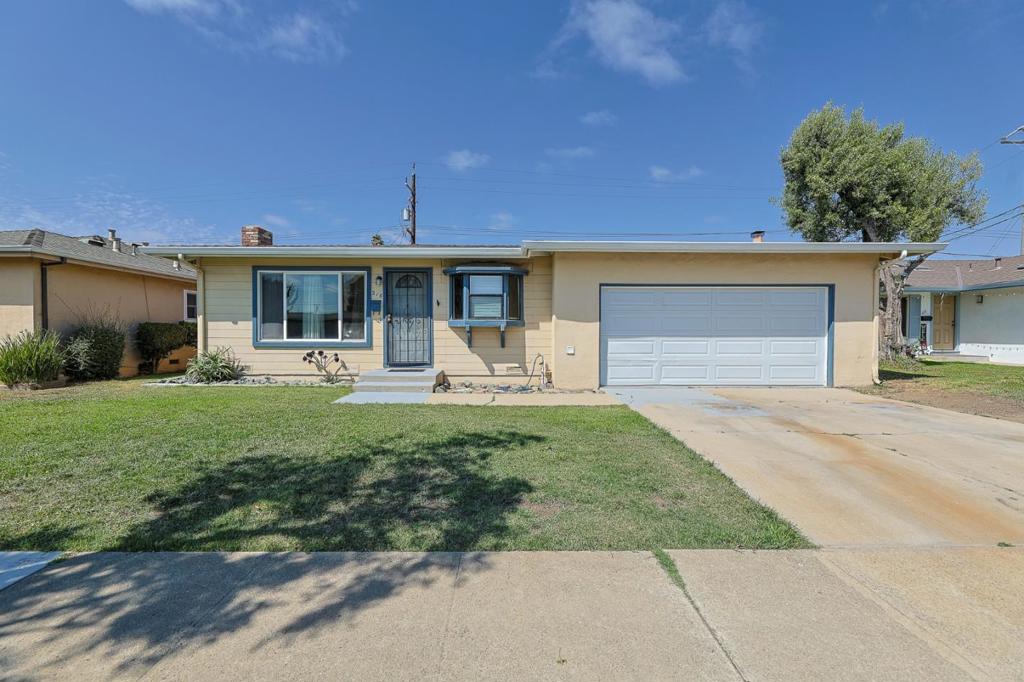 Welcome to this charming home located in the heart of Salinas. This residence offers three generously sized bedrooms and two full bathrooms, providing ample space for comfortable living. The kitchen is seamlessly integrated with the family room, creating a warm and inviting space perfect for gatherings. The dining area further enhances the functionality of the home. The property boasts wood flooring throughout, adding a touch of elegance and warmth to the interiors. Central forced air heating and a cozy fireplace ensure comfort during cooler months. While there is no cooling system, the home's well-designed layout allows for natural ventilation. Additional amenities include a two-car garage, providing convenient parking and storage. The home is situated within the Salinas City Elementary School District, offering access to local educational institutions for families. With a minimum lot size of 6,000 sq ft and a total living space of 1,134 sq ft, this home is ideal for those seeking a comfortable and well-appointed residence in Salinas.