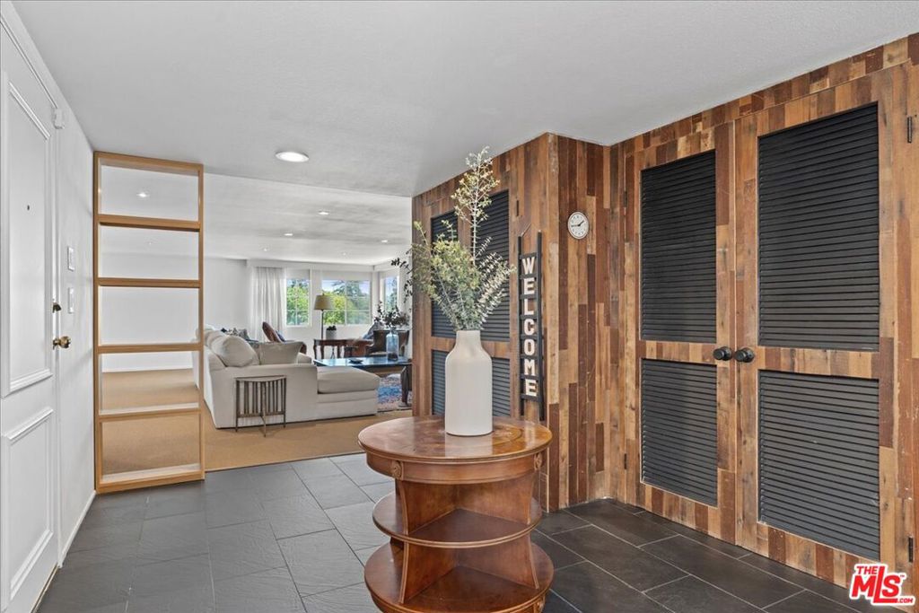 Discover an impressive blend of space, style, and comfort in this premier end unit Sherman Oaks condo with no overhead neighbors and no common walls, boasting over 2,700 Sqft. of living area. With 3 spacious bedrooms and 3 bathrooms, this light-filled residence showcases an open-concept layout with soaring ceilings and brand-new carpet in multiple rooms. Positioned at the back of the building, the unit faces the hills and surrounding neighborhood, not Coldwater Canyon, providing a peaceful, quiet retreat. The sleek kitchen is highlighted by sparkling countertops, a chic island with barstool seating, a custom built-in wine rack, and abundant storage, all seamlessly connected to the dining and living spaces, ideal for entertaining and everyday living. The expansive primary suite offers the potential for an extra sitting area, home office, or private retreat, and is complete with a generous walk-in closet and spa-inspired en-suite bath featuring dual vanities, a step-in shower, and built-in storage. Two additional bedrooms are equally well-appointed, each with ample closet space and access to a beautifully updated hallway bath with a luxe step-in shower. The Seller has invested over $150,000 in thoughtful updates, making this home completely turnkey for its next owner. Resort-style community amenities include a pool, recreational room, and two side-by-side gated parking spaces. Just moments from Whole Foods, Ventura Boulevard's shops and dining, and with easy freeway access, this residence perfectly pairs modern convenience and sophisticated Valley living. For added value and ease, the condo can also be sold complete with all current furnishings, offering a true move-in-ready opportunity. Welcome!