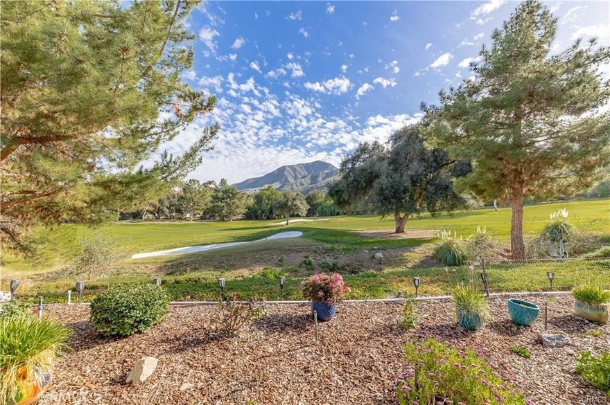 Beautiful Glen Ivy Golf Course VIEW Home that sits on the 7th fairway in the desirable 55+ gated community of Trilogy, QUIET & PRIVATE. Great Location, absolutely one of the BEST Views and locations in Trilogy. This upgraded home is in pristine condition, move-in ready, almost 1600 sq. (approx. 1572 sq ft.) You will have no electricity bill because this home is Solar equipped.  This will save you lots of money monthly!  EASY TO MAINTAIN. Featuring PAID OFF SOLAR WITH BACK UP BATTERY and a water softener system. OPEN FLOOR PLAN, Gourmet kitchen with granite counters, newer SS appliances, maple cabinets, New Farm House Sink, chef’s island with bar seating which opens up to the great room Wood Flooring and a private courtyard. Golf course views & Mountain View’s from the great room & primary bedroom. Builder optional extended master bedroom walk-in closet for added space and features closet organizer and Builder option extended laundry room providing a built in sink. The Primary and Guest suite are nice sized, a flex room which is currently used as an office. Enjoy the view of the golf course & Cleveland National Forest from your outdoor patio with New maintenance free Alum wood patio cover, Self watering garden. Bosh refrigerator, washer & dryer included. Front Yard Maintenance is maintained by HOA.  Rear yard gardener will be supplied.  Trilogy is an active 55+ adult community surrounded by the Glen Ivy Golf Course and the Cleveland National Forest with many wonderful facilities, such as indoor and outdoor pools, hot tub, BBQ's, tennis courts, state of the art gym, indoor walking track, exercise classes, ballroom, amphitheater, pickleball, bocce ball, arts & crafts center, billiards room, WIFI, dances, dinners, Bistro by the pool & many social opportunities and clubs. All of this near Lots of shopping, the Glen Ivy Hot Springs Spa. This is True Resort Style Living at its Fullest