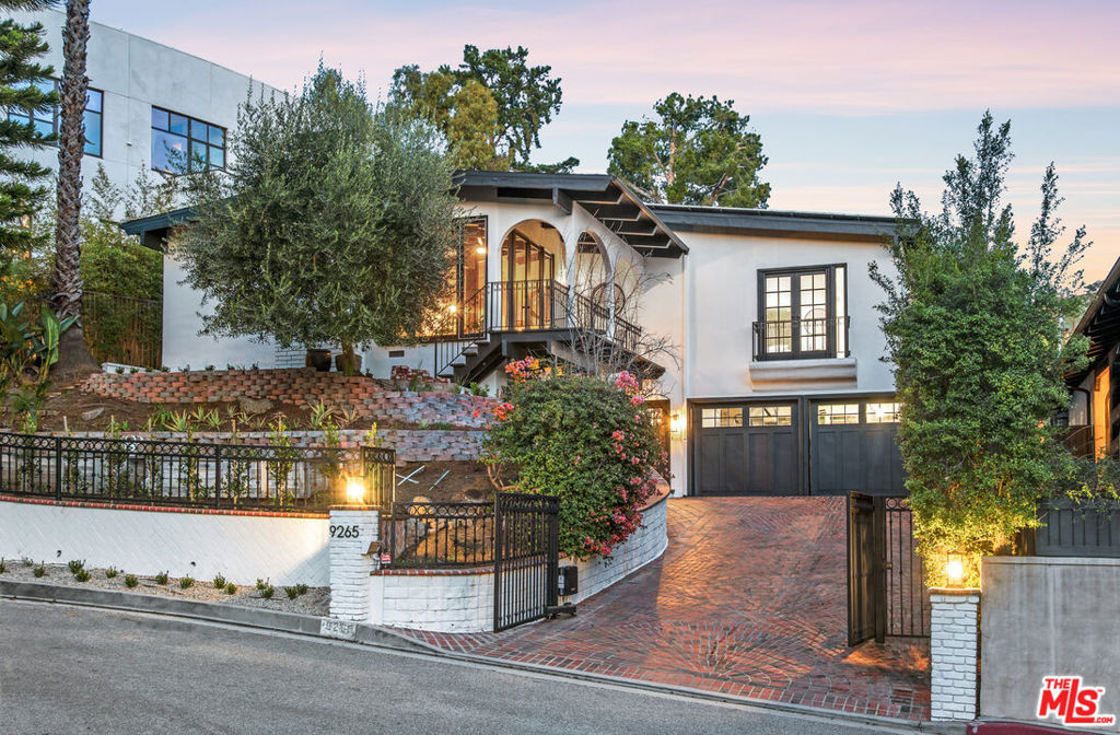 A newly renovated, gated, post and beam sanctuary, nestled in the renowned Bird Streets, for its beautiful views and privacy. This home offers an open concept kitchen with Viking appliances, waterfall island, a breakfast bar, coffee bar, and wine fridge. Engineered hardwood flooring throughout. All bathrooms are newly renovated.Two large en-suite bedrooms have expansive canyon, city & ocean views. The third large en-suite bedroom has a private patio & separate outdoor entrance on the ground level. Ground level has a large laundry room.Enjoy the ocean and city views from the floor to ceiling windows in the living room which has a wood burning fireplace and magnificent vaulted wood beamed ceilings. The indoor-outdoor flow floor plan throughout the house brings in lots of natural light and lets you enjoy the multiple private & peaceful outdoor living spaces. This quiet oasis is freshly painted and includes fully owned solar panels with battery backup, whole house water filter system, two 240-volt outlets in garage for EV charging, and operable skylights. This home is located on a quiet cul-de-sac in one of Los Angeles most prestigious neighborhoods.
